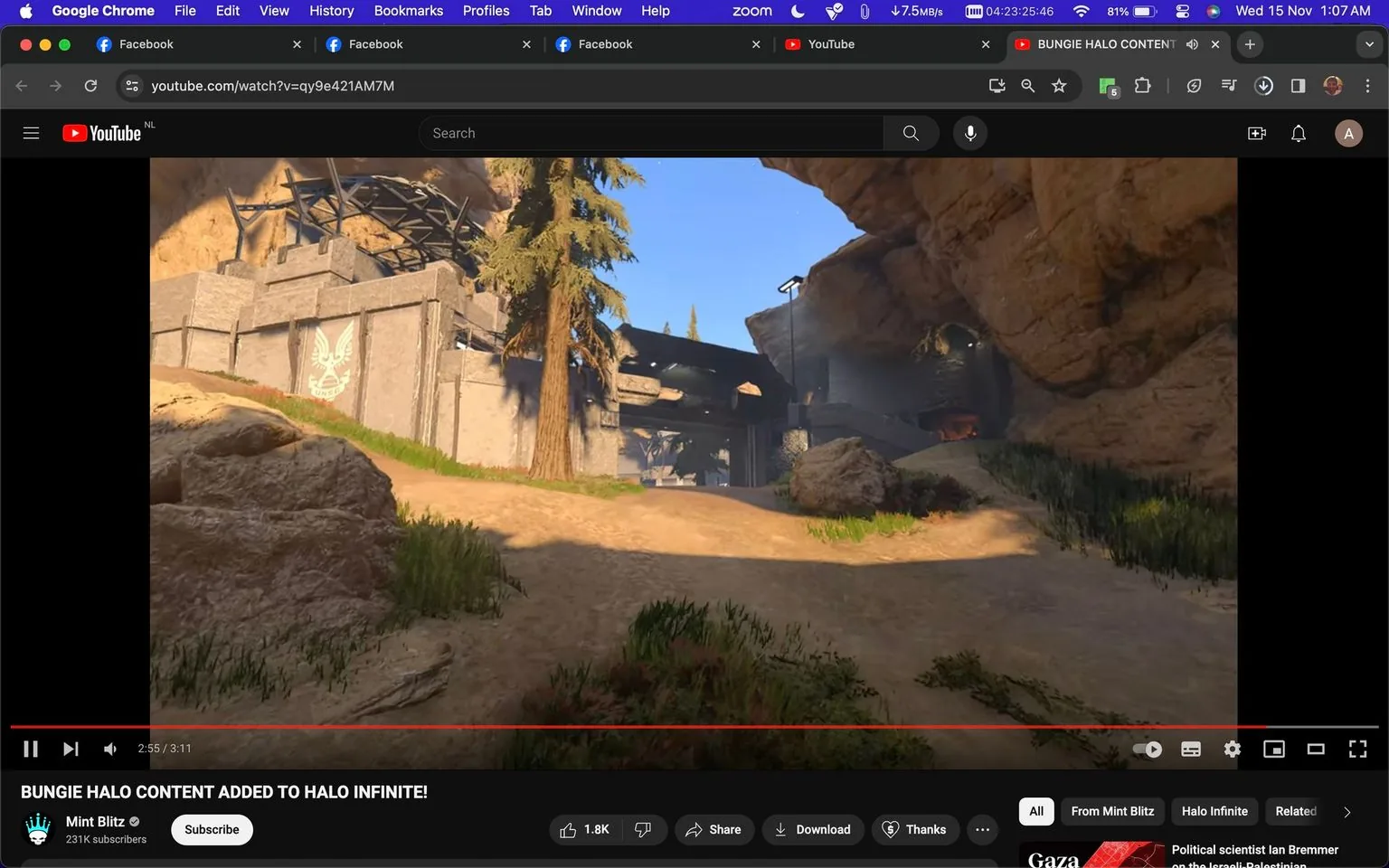 1) Rich description:
The screenshot showcases a YouTube video titled "BUNGIE HALO CONTENT ADDED TO HALO INFINITE!" from the channel Mint Blitz. The video player interface is prominently displayed, capturing a moment from the game "Halo Infinite." The scene features an outdoor desert-like environment with rocky terrain and sparse greenery. A prominent structure, possibly a bunker or outpost, is visible in the background, adorned with an emblem or insignia. Tall pine trees add vertical elements to the landscape, contrasting against the clear blue sky. The lighting suggests a sunny day, enhancing the colors of the natural and constructed elements. The interface at the bottom shows typical YouTube features like play buttons, volume control, and video length, with the video being 3 minutes and 11 seconds long. Viewer engagement indicators such as likes and subscriber count are also visible, showing 1.8K likes and 231K subscribers for the Mint Blitz channel. The desktop browser's tab and URL bar are visible, indicating active tabs like Facebook and Google Chrome utilities.
2) On-screen text block:
- Title: "BUNGIE HALO CONTENT ADDED TO HALO INFINITE!"
- Channel / profile: "Mint Blitz"
- Site / app: "YouTube"