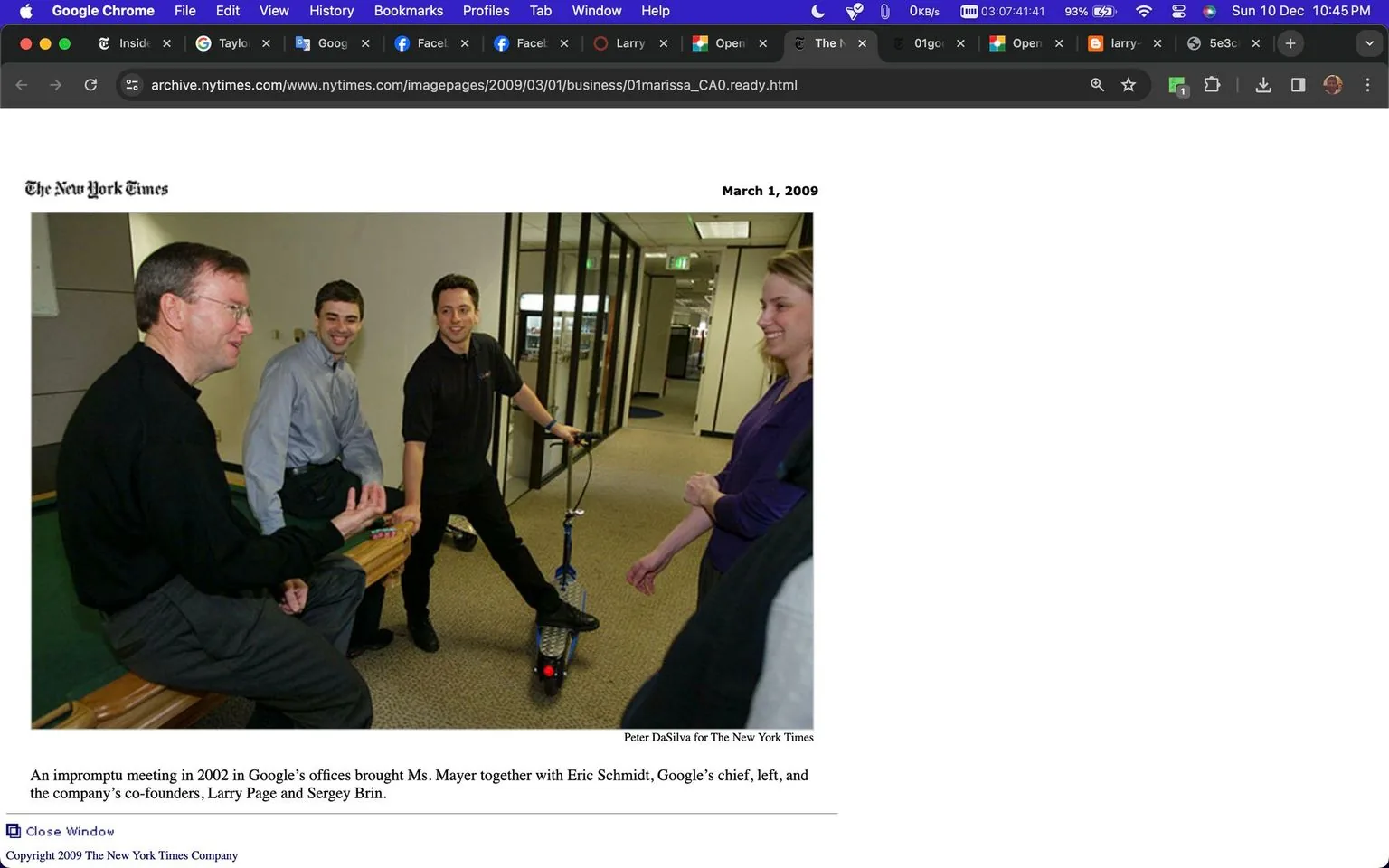 1) Rich description: The image shows an informal meeting at Google's offices in 2002, featuring prominent figures in technology. Eric Schmidt, Larry Page, Sergey Brin, and Marissa Mayer are present, as per the hint. Eric Schmidt is seated on a pool table, gesturing with his hands, while Larry Page and Sergey Brin stand nearby, both seemingly engaged in a light-hearted conversation. Sergey Brin is holding a scooter, suggesting a casual and innovative work environment. Marissa Mayer stands to the right, smiling, adding to the relaxed atmosphere. The office setting is modern, with glass walls and typical office lighting. Everyone is dressed in business casual attire, reflecting a typical day at Google during that era. The mood is friendly and collaborative, indicative of Google's culture at the time.
2) On-screen text block:
- Title: "An impromptu meeting in 2002..."
- Site / app: "The New York Times"
- Captions / subtitles: "An impromptu meeting in 2002 in Google’s offices brought Ms. Mayer together with Eric Schmidt, Google’s chief, left, and the company’s co-founders, Larry Page and Sergey Brin."