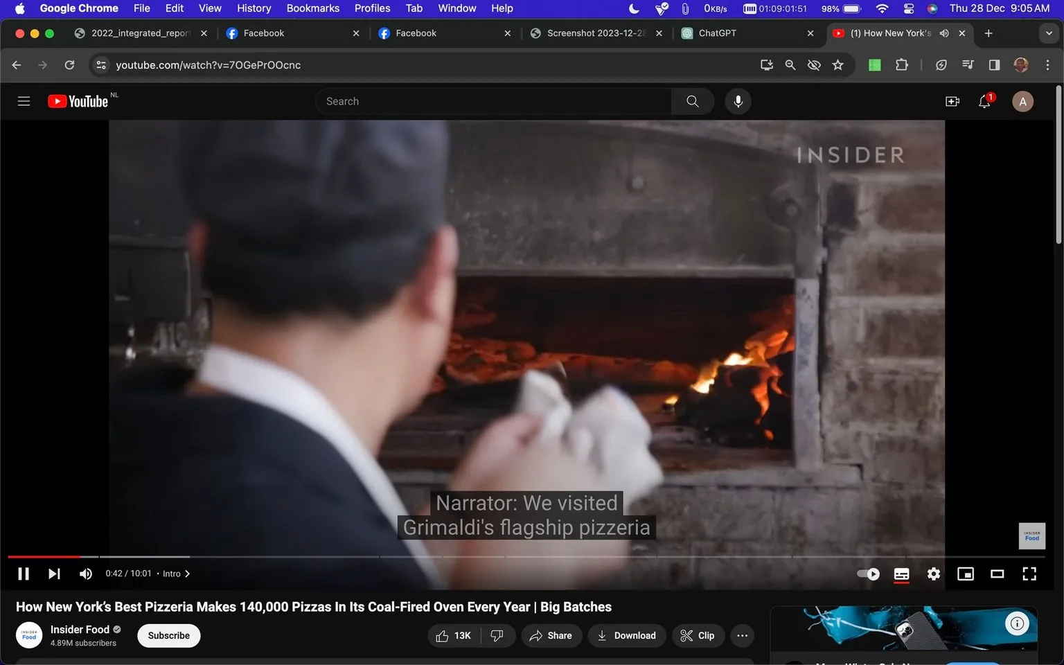 The image is a screenshot from a YouTube video titled "How New York's Best Pizzeria Makes 140,000 Pizzas In Its Coal-Fired Oven Every Year | Big Batches," featured on the "Insider Food" channel. The setting is an indoor scene inside a pizzeria, where a person, possibly a chef, is glimpsed from behind as they work with a coal-fired oven. The oven is open, revealing glowing coals and flames, suggesting an active cooking process. The chef is wearing a dark cap and white apron, typical attire for someone working in food preparation. The lighting is warm, accentuated by the glow from the oven flames.
The on-screen text includes a subtitle from the narrator saying, “We visited Grimaldi's flagship pizzeria,” referring to the famous pizzeria known for its coal-fired pizzas. The video aims to provide insight into the traditional methods used by Grimaldi's to prepare a large volume of pizzas annually. The atmosphere conveyed is one of authenticity and craftsmanship, emphasizing the artisanal nature of the pizzeria's approach. The visual composition focuses on the interaction between the chef and the oven, highlighting the heat and energy of the cooking process.