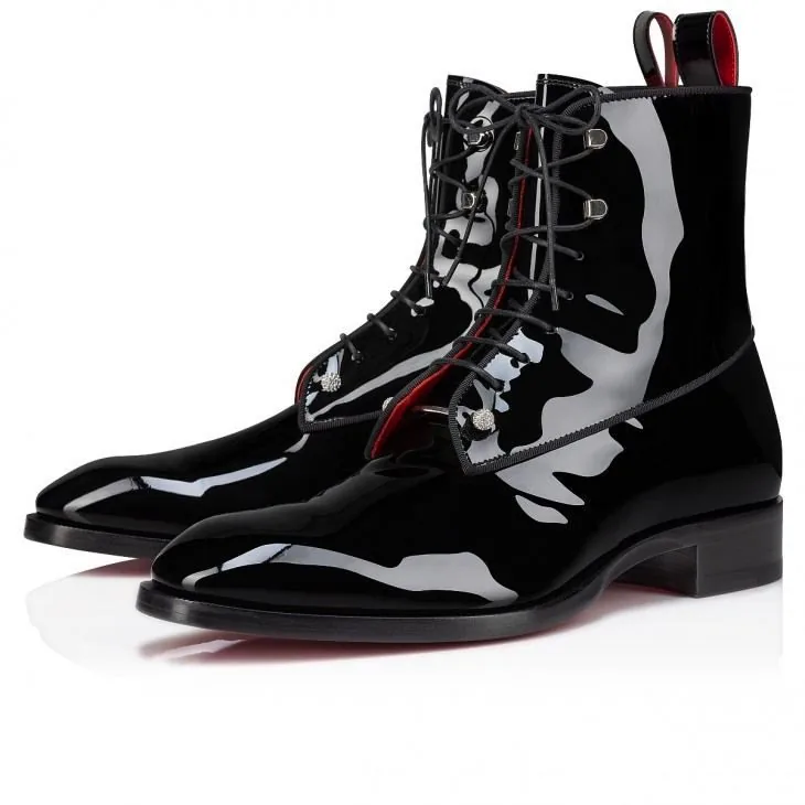 The image showcases a pair of glossy black boots, emphasizing a sleek and polished design. The boots are ankle-high with a pointed toe, crafted from patent leather, which gives them a shiny appearance. They feature a lace-up front with black laces threaded through metallic eyelets, adding a touch of elegance. The inner lining of the boots is a striking red, visible just beneath the laces, providing a bold contrast to the dark exterior. The heel is modestly elevated, suitable for both style and comfort.
The boots are positioned against a simple white background, typical of product photography, to draw focus entirely to the footwear. The lighting is bright and even, highlighting the reflective surface of the leather. These boots evoke a sense of sophistication and are reminiscent of classic styles with a modern twist. The description connects with the famous song "These Boots Are Made for Walkin'," suggesting a cultural or stylistic inspiration behind the design.