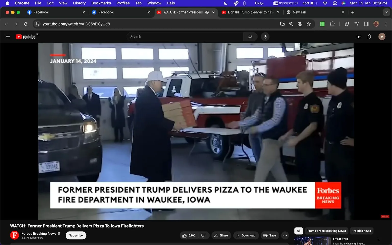 In this image, taken from a YouTube video by Forbes Breaking News, former President Trump is seen delivering pizza to the Waukee Fire Department in Iowa. The scene takes place indoors, likely in the garage area of the fire station. Trump, wearing a dark overcoat and a white baseball cap, is holding a stack of pizza boxes. He is in the process of handing them to a man in a plaid shirt and vest, who stands by a table next to several firefighters in uniform. A red and white fire truck is visible in the background, adding to the context of the location. The lighting is bright and natural, coming from large garage doors that allow daylight to enter. The mood appears informal and community-focused, with Trump engaging directly with the fire department personnel. The image captures a moment of interaction and gesture of goodwill, emphasized by the headline text at the bottom of the frame. The video screenshot was captured on YouTube, as indicated by the browser's interface visible at the top of the image.
- Title: "WATCH: Former President Trump Delivers Pizza To Iowa Firefighters"
- Channel / profile: "Forbes Breaking News"
- Site / app: "YouTube"