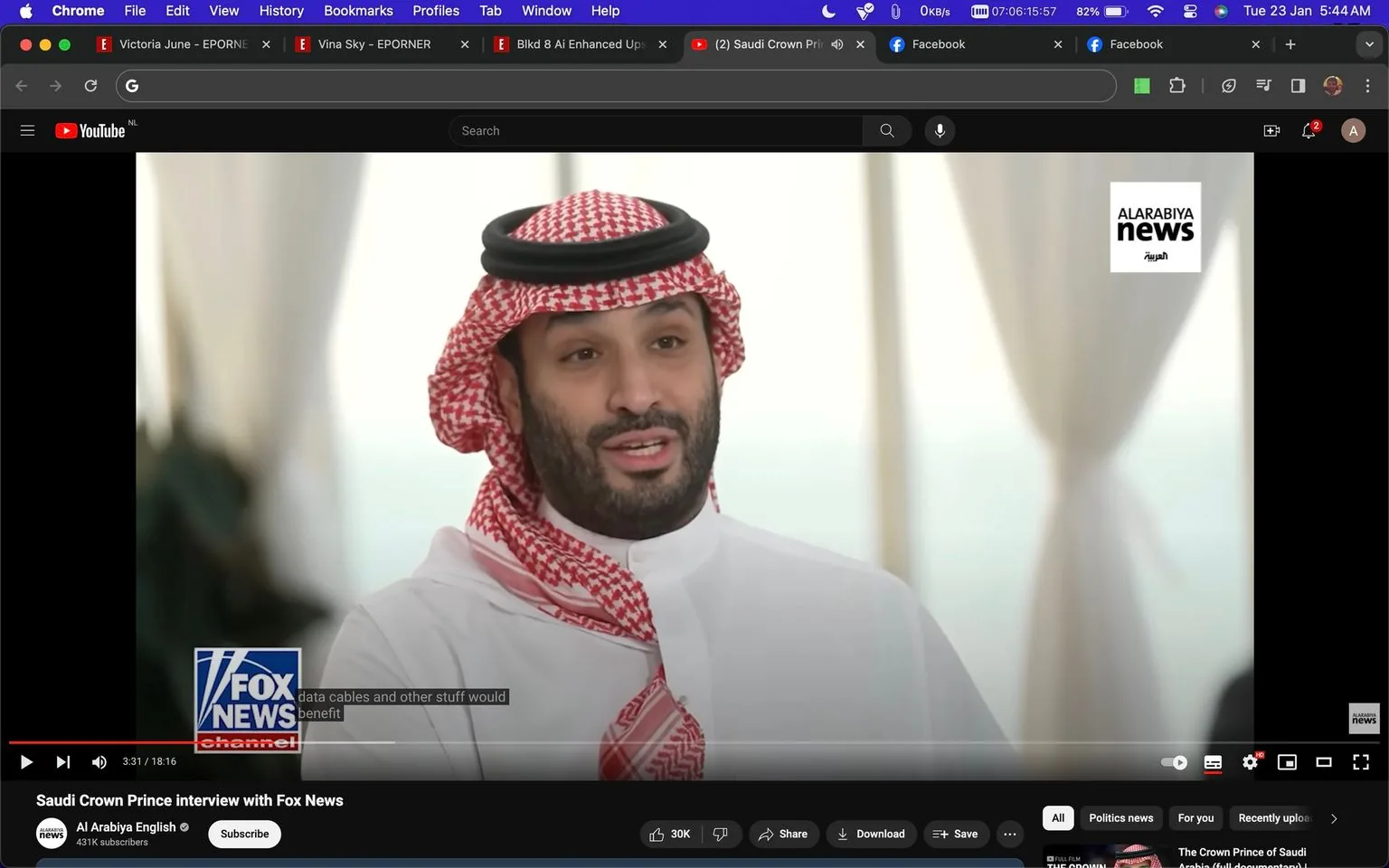 The image is a video frame from an interview titled "Saudi Crown Prince interview with Fox News." It is being shown on YouTube, hosted by the channel "Al Arabiya English." The scene features Crown Prince Mohammad bin Salman in a formal interview setting. He wears traditional Saudi attire, including a red and white checkered keffiyeh with an agal, and a white thobe.
The background is softly blurred, highlighting the Crown Prince as the focal point of the image. The lighting is bright and natural, suggesting a well-lit interior space, possibly a studio or a formal meeting room. To the right of the frame, there is a logo for "ALARABIYA news," and another for "FOX NEWS channel" at the bottom left corner, indicating the networks involved in the interview.
The caption visible reads, "data cables and other stuff would benefit," hinting at a discussion involving technology or infrastructure. The overall atmosphere is professional and composed, reflecting the serious nature of the interview.