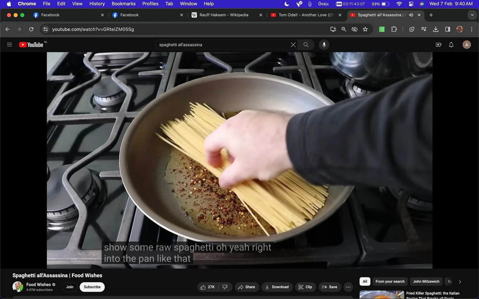 The image is a YouTube screenshot from the "Food Wishes" channel, titled "Spaghetti all'Assassina." It features a kitchen scene with a stove in the background. A hand is placing raw spaghetti into a pan that contains oil and red pepper flakes. The stove burners are visible, indicating a typical cooking environment. The lighting is natural, highlighting the ingredients and making the scene appear warm and inviting. The focus is on the preparation of the dish, with the hand actively arranging the spaghetti in the pan. The video appears to be a cooking tutorial or demonstration by the channel "Food Wishes," which is known for such content. The screenshot includes captions that describe the action: "show some raw spaghetti oh yeah right into the pan like that." The URL and search terms related to the video are visible at the top, along with typical browser elements and open tabs.
- Title: "Spaghetti all'Assassina | Food Wishes"
- Channel / profile: "Food Wishes"
- Site / app: "YouTube"
- Captions / subtitles: "show some raw spaghetti oh yeah right into the pan like that"