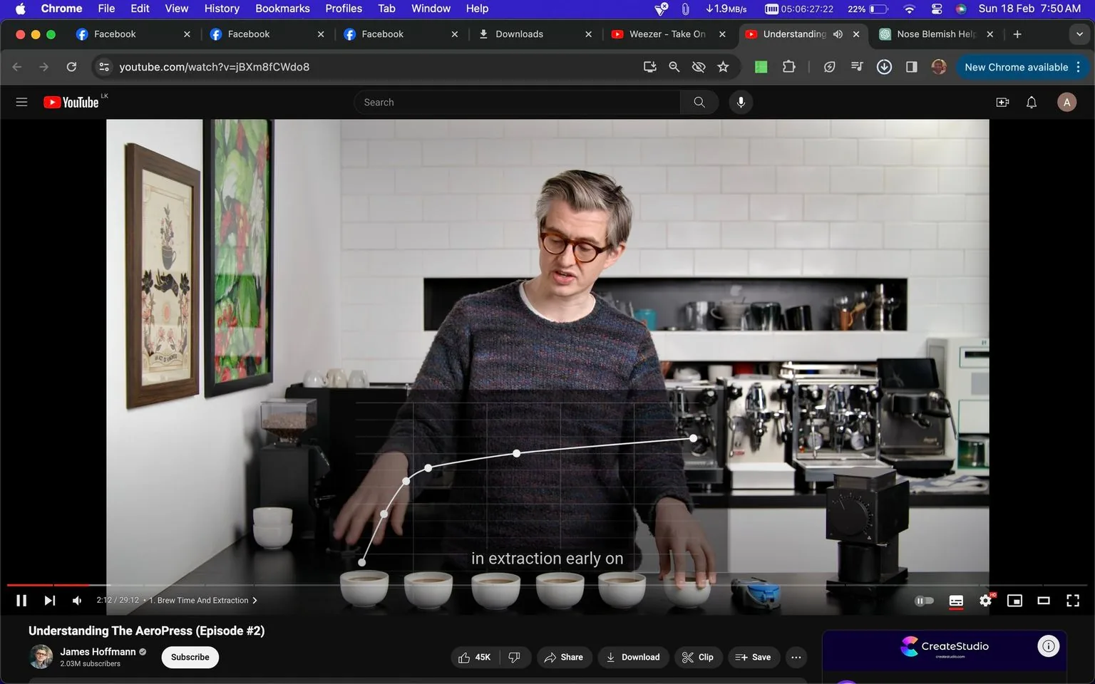 The image is a screenshot from a YouTube video titled "Understanding The AeroPress (Episode #2)" on the channel of James Hoffmann. The scene is set indoors in a kitchen with a focus on coffee brewing. James Hoffmann is standing behind a counter, where several coffee cups are neatly lined up. He is wearing glasses and a dark, patterned sweater. The background features a white tiled wall with various coffee machines and equipment, suggesting a setting dedicated to coffee preparation. On the left, colorful framed artwork adorns the wall. The lighting is bright, highlighting the details of the coffee cups and the graph displayed on the screen, which appears to be part of a discussion about coffee extraction. The subtitle "in extraction early on" suggests a detailed explanation of the brewing process. The interface shows typical YouTube elements like the play button, video progress bar, and viewer engagement metrics. The overall mood is educational and focused on coffee expertise.
- Title: "Understanding The AeroPress (Episode #2)"
- Channel / profile: "James Hoffmann"
- Site / app: "YouTube"
- Captions / subtitles: "in extraction early on"