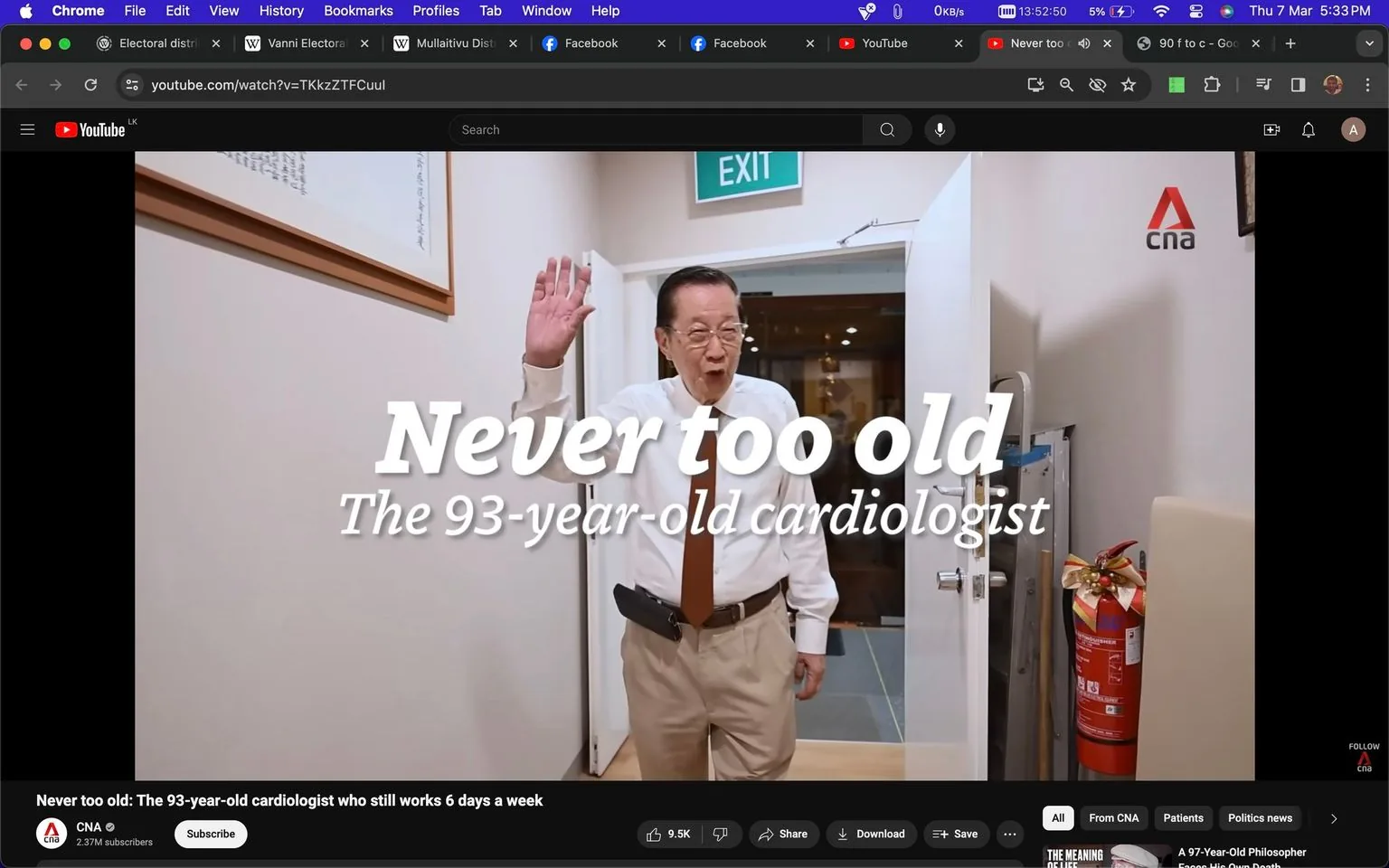 The image is a screenshot from a YouTube video titled "Never too old: The 93-year-old cardiologist who still works 6 days a week," published by CNA. It features a scene inside an office, where a man presumed to be the 93-year-old cardiologist is captured mid-action as he waves. He is wearing a white dress shirt, brown tie, and beige pants, projecting a professional and approachable demeanor. The background includes an open door with an "EXIT" sign above it, a fire extinguisher adorned with a bow, and a framed artwork on the wall, suggesting a personal touch to the workspace. The lighting is bright and even, enhancing the welcoming and lively atmosphere. The on-screen text prominently displays "Never too old" and "The 93-year-old cardiologist," emphasizing the theme of age defying work ethics. The video is from CNA, as indicated by the logo present in the top right corner, and it has a significant following, suggesting its reach and influence.