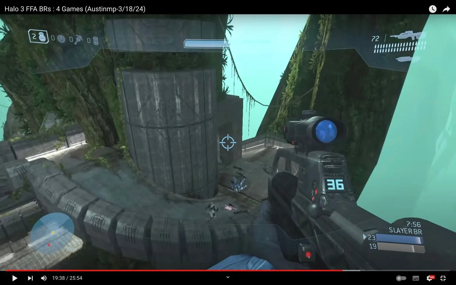 The image is a frame from a YouTube video titled "Halo 3 FFA BRs : 4 Games (Austinmp-3/18/24)." It showcases gameplay from the video game "Halo 3," specifically a multiplayer match using the Battle Rifle (BR). The scene is set in a sci-fi environment with a futuristic, industrial design. The player's perspective shows the aiming reticle focused on a structure in an open outdoor area, surrounded by lush greenery and large concrete-like structures.
On the screen, the player’s ammo count and weapon details are visible on the heads-up display, indicating that the player is engaged in an ongoing match. The minimap at the bottom left indicates the positions of other players or objectives. The graphics are typical of a first-person shooter with a clean interface and detailed textures, providing an immersive gaming experience. The lighting is bright, suggesting daytime, and the overall mood is tense and competitive, characteristic of a free-for-all multiplayer battle.