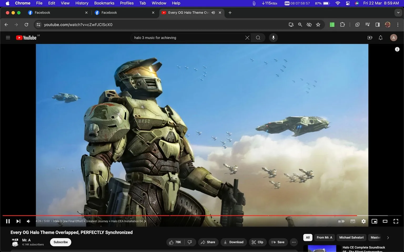 The image is a screenshot from YouTube, showing a video titled "Every OG Halo Theme Overlapped, PERFECTLY Synchronized" from the channel Mr. A. It prominently features artwork of the character known as Master Chief from the Halo series. Master Chief is depicted in his iconic green armor, standing against a bright blue sky filled with clouds. Various aircraft can be seen flying in formation in the background, enhancing the feeling of a military operation in a science fiction setting. The words "UNSC" are visible on the chest plate of his armor, indicating his affiliation with the United Nations Space Command. The scene conveys a sense of readiness and strength, with Master Chief holding a weapon and gazing into the distance. The video appears to be related to the music from the Halo series, as suggested by the title and the specific named work, "Halo." The YouTube interface shows typical elements like the search bar, subscribe button, and video progress bar, adding context to the digital setting.