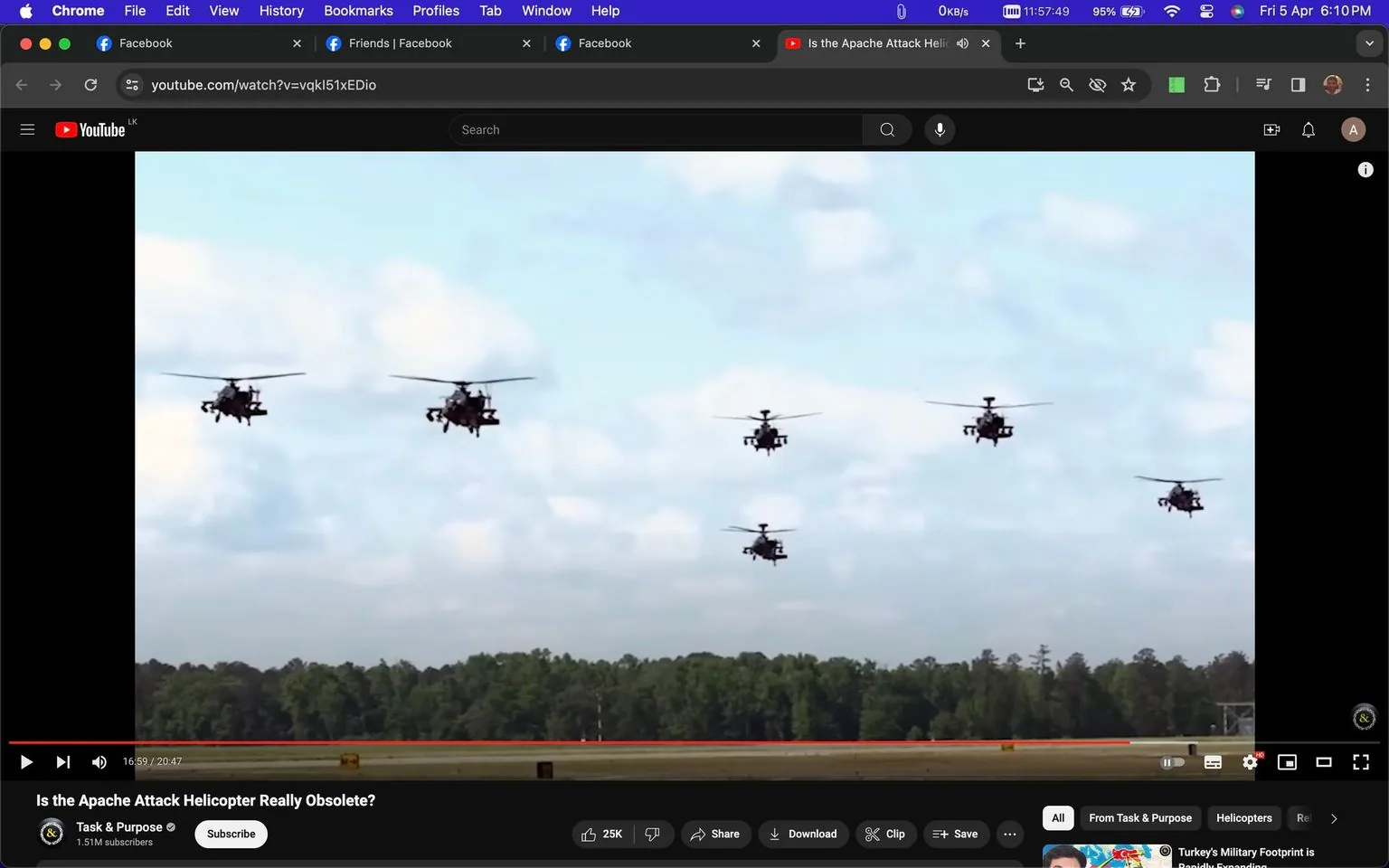 The image is a screenshot from a YouTube video titled "Is the Apache Attack Helicopter Really Obsolete?" by the channel Task & Purpose. The scene shows a formation of Apache AH64 gunships flying across a clear blue sky. There are six helicopters visible, flying in a staggered formation over a forested area. The helicopters are silhouetted against the light sky, showcasing their recognizable rotor blades and sleek military design. The video player interface is visible, indicating that the video is paused at 16:59 of a total 20:47 playtime.
The top of the screen shows a toolbar typical of the Chrome browser, with open tabs including Facebook and YouTube. The interface at the bottom includes options for liking, sharing, downloading, or saving the video, as well as icons indicating the number of subscribers and likes. The helicopters' presence conveys a sense of precision and power, characteristic of military aviation. The scene is captured in an outdoor setting, highlighting the staged formation commonly associated with military displays or training exercises.