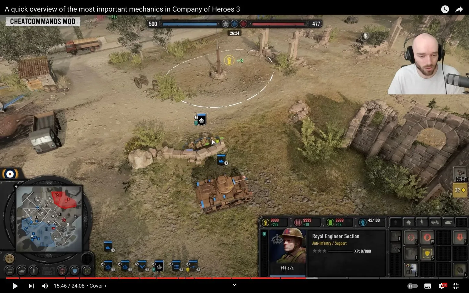 1) Rich description: The image is a frame from a video showcasing gameplay from the strategy game "Company of Heroes 3." The scene highlights a strategic overview with a military unit depicted on a battlefield. In the center, a group of soldiers is positioned behind cover, indicated by the sandbags. Below them is a tank, reinforcing the military theme. The game interface displays various controls and information bars at the bottom, including resource counters and unit details. On the right, the "Royal Engineer Section" is noted, indicating the unit's role as anti-infantry and support. The map in the bottom left corner shows the strategic positioning with colored zones representing different factions. The overlay text mentions "CHEATCOMMANDS MOD," suggesting modifications for gameplay purposes. In the top right corner, a man with headphones, possibly the video presenter, appears in a small inset, focusing on the screen with a neutral expression. The visual setting is a mix of gameplay action and instructional content.
2) On-screen text block:
- Captions / subtitles: "A quick overview of the most important mechanics in Company of Heroes 3"