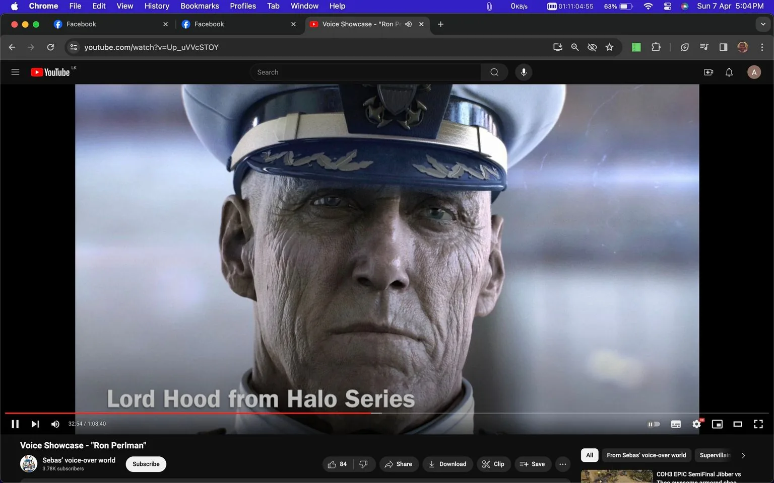 The image is a screenshot from a YouTube video titled "Voice Showcase - \"Ron Perlman\"" on the channel "Sebas' voice-over world." The scene features a close-up of a character named Lord Hood from the Halo Series. The character is depicted as an older, stern-looking man in a naval uniform, complete with a cap adorned with military insignia. The lighting is soft, emphasizing the character's rugged facial features and expression of authority and resolve. The text "Lord Hood from Halo Series" is overlaid near the bottom of the image. The background is blurred, drawing focus to the character's face. Overall, the screenshot highlights character design and voice acting within the Halo video game series, specifically showcasing Ron Perlman's involvement.