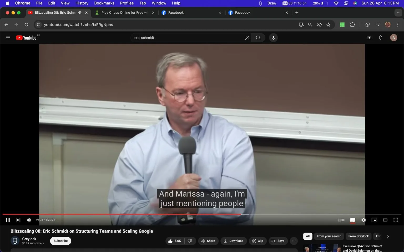 Eric Schmidt is speaking in an indoor setting, likely a classroom or lecture hall, as evidenced by the visible whiteboard in the background. He is holding a microphone and appears to be mid-sentence, suggesting he is engaged in a discussion or giving a lecture. Eric Schmidt is wearing a light blue dress shirt and glasses, projecting a professional appearance suitable for a formal talk or presentation. The lighting is even and bright, typical of an indoor academic or conference environment.
The video is titled "Blitzscaling 08: Eric Schmidt on Structuring Teams and Scaling Google," indicating that the subject matter revolves around business strategies and organizational management within a tech context. The channel hosting the content is "Greylock," which is visible below the video. The subtitle displayed reads, "And Marissa - again, I'm just mentioning people," suggesting that Eric Schmidt is referencing individuals relevant to the discussion, possibly colleagues or figures important to the topic. The YouTube video interface shows typical elements such as the progress bar, play/pause button, and viewer interaction options like thumbs up and comments, indicating an active engagement platform for the audience.