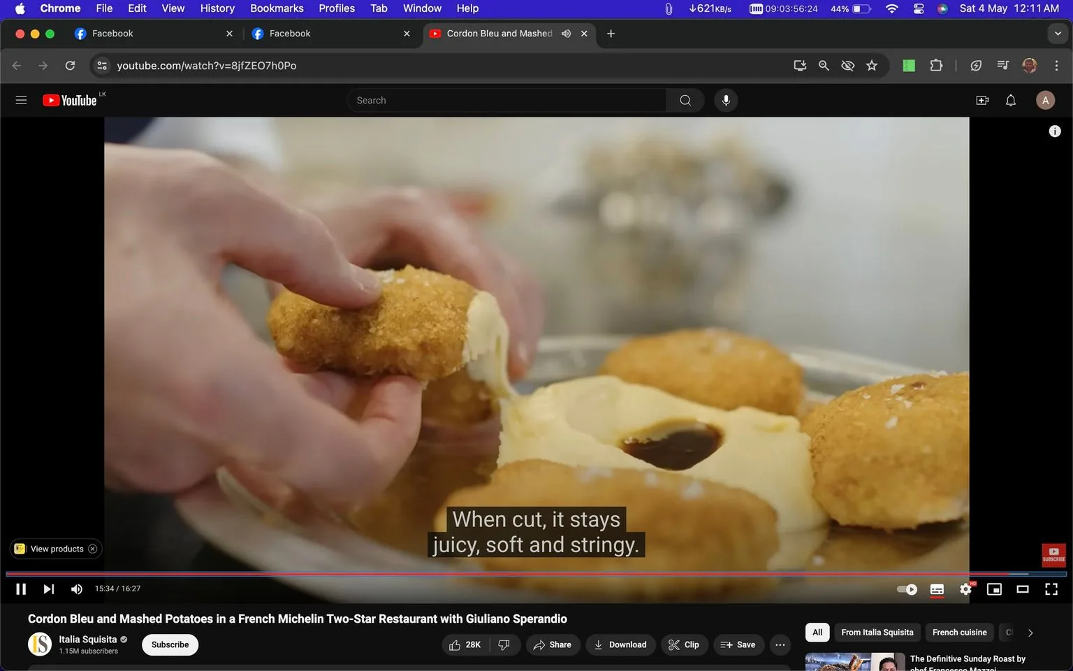 The image is a frame from a YouTube video titled "Cordon Bleu and Mashed Potatoes in a French Michelin Two-Star Restaurant with Giuliano Sperandio," hosted on the "Italia Squisita" channel. The scene captures a pair of hands gently breaking apart a piece of golden-brown, breaded Cordon Bleu. The filling appears creamy and stringy, suggesting a rich, melted cheese interior. This appetizing dish is set on a plate next to a pool of smooth mashed potatoes with a dark sauce at its center, likely adding a savory contrast. The subtitle reads, "When cut, it stays juicy, soft and stringy," emphasizing the dish's desirable texture. The kitchen setting, implied by the blurred background, creates a professional culinary environment. The lighting is bright, enhancing the food's appeal, and draws attention to the texture and color of the Cordon Bleu.