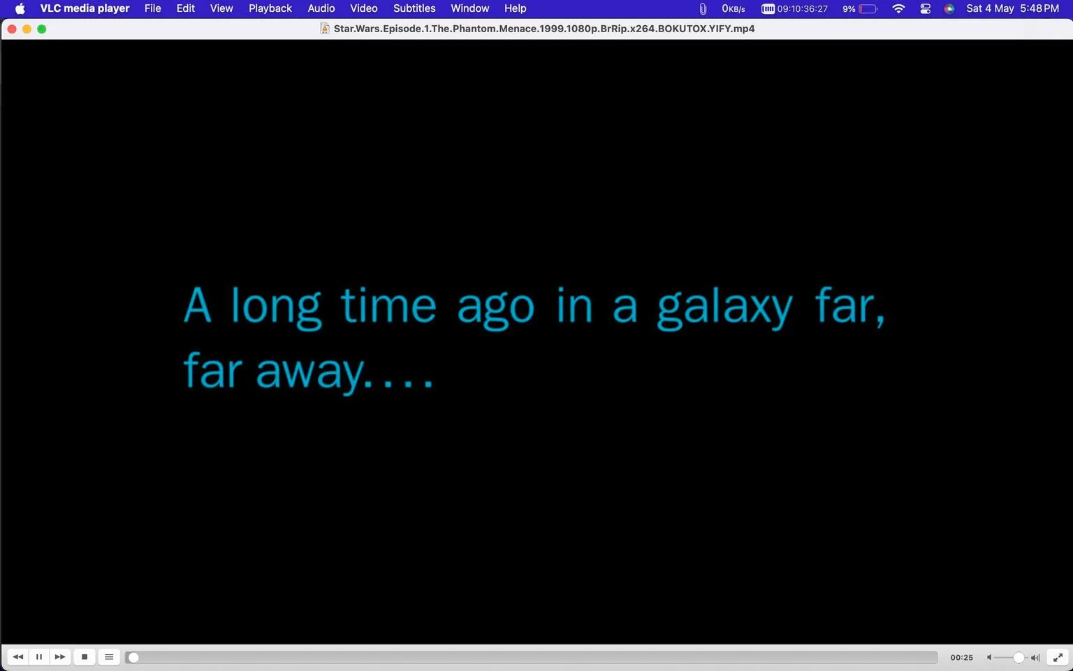 The image is a screenshot from the VLC media player showing the iconic opening text of "Star Wars." The background is black, with bright blue text in the foreground that reads, "A long time ago in a galaxy far, far away...." This text is well-known for its association with the Star Wars film franchise, setting the stage for the epic space saga. The file name at the top of the VLC window indicates that this is from "Star.Wars.Episode.1.The.Phantom.Menace.1999.1080p.BrRip.x264.BOKUTOX.YIFY.mp4," suggesting it is the beginning of "Star Wars: Episode I – The Phantom Menace." The player interface shows standard controls, with a progress bar at the bottom. The timestamp indicates the video is 25 seconds in, which is typically the timing for this introductory sequence. The style is minimalistic, focusing solely on the text to evoke anticipation and nostalgia for the Star Wars universe.