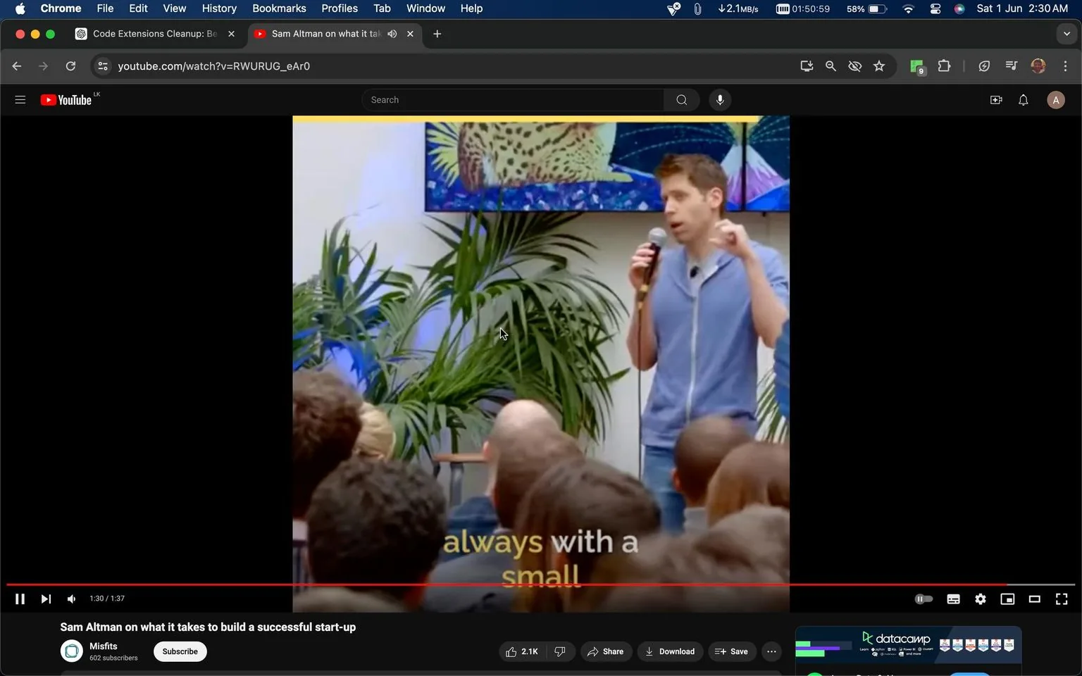 The image is a video frame from YouTube, featuring Sam Altman speaking at an event. The setting is indoors, with plants in the background and a colorful artwork on the wall. Sam Altman is holding a microphone, wearing a blue zip-up jacket over a t-shirt, and appears to be addressing an audience seated in front of him. The mood is informative and engaging, as he is likely sharing insights on building a successful start-up. The attendees are focused on him, creating a setting typical of a presentation or a talk. The video is titled "Sam Altman on what it takes to build a successful start-up" and is hosted on the YouTube channel "Misfits." The caption at the bottom of the screen reads "always with a small," suggesting this is part of a larger sentence or advice being given. The frame captures the interactive nature of such events, where ideas and experiences are shared with aspiring entrepreneurs.