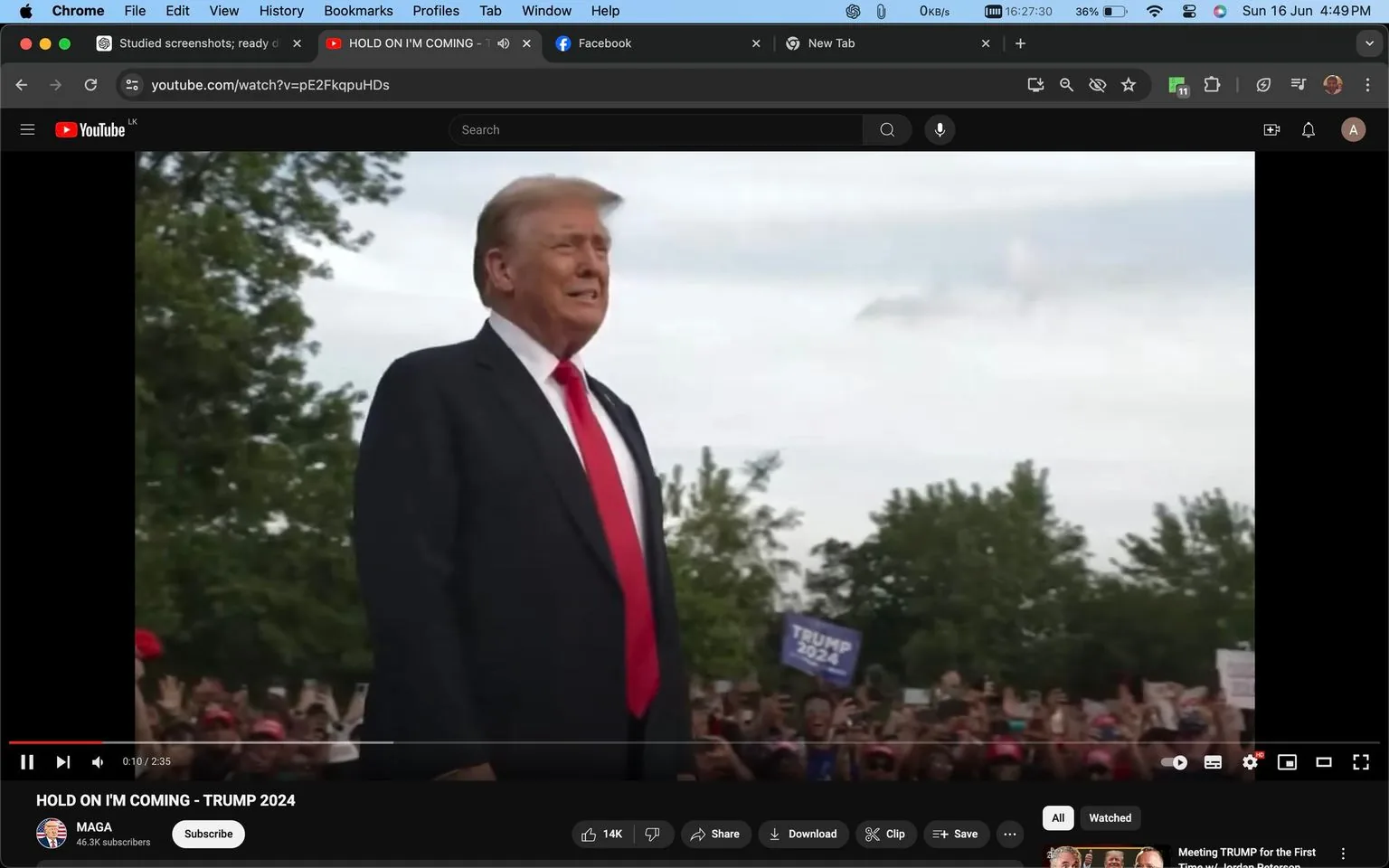 1) Rich description (8–12 sentences): The screenshot shows Donald Trump standing outdoors at what appears to be a rally. He is wearing a dark suit with a white shirt and a red tie. His posture is upright, and he has a slight smile on his face, conveying a confident demeanor. The background features a crowd of people, some of whom are holding up signs and wearing hats, suggesting a supportive audience. One visible sign in the crowd reads "TRUMP 2024," indicating the political theme of the event. The setting is daytime, with trees visible in the background under a partly cloudy sky. The video is playing on YouTube, as indicated by the interface elements, including the play bar and video title. The title of the video is "HOLD ON I'M COMING - TRUMP 2024," and it is posted by a channel named "MAGA," which has 46.3K subscribers. The overall scene captures a political rally atmosphere with significant public engagement.
2) On-screen text block:
- Title: "HOLD ON I'M COMING - TRUMP 2024"
- Channel / profile: "MAGA"
- Site / app: "YouTube"
- Captions / subtitles: (none)