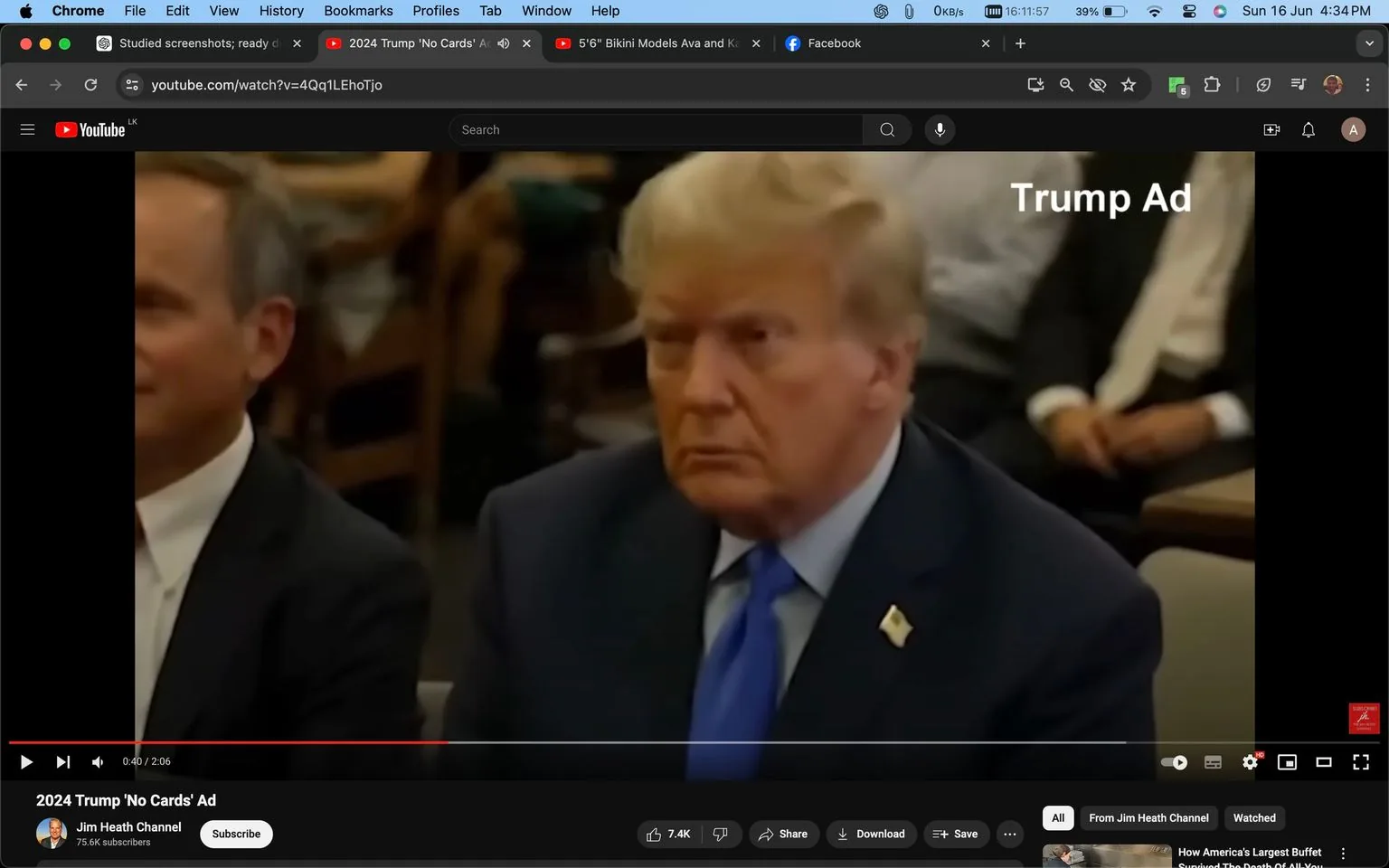 1) Rich description (8–12 sentences): The image is a screenshot of a YouTube video titled "2024 Trump 'No Cards' Ad," from the Jim Heath Channel. The focus is on Donald Trump, who is seated prominently in the center of the frame. He is wearing a dark suit with a white shirt and a bright blue tie, with a small American flag pin on his lapel. His expression appears serious and focused. The setting is indoors, with people blurred in the background, suggesting a formal or public event, possibly a meeting or conference. The lighting is even, highlighting Trump's features and attire. The on-screen text in the upper right corner reads "Trump Ad," indicating the context of the video as a promotional or campaign-related material. The visible interface elements, including a play bar and video controls, suggest this is a paused moment in the video.
2) On-screen text block:
- Title: "2024 Trump 'No Cards' Ad"
- Channel / profile: "Jim Heath Channel"
- Site / app: "YouTube"