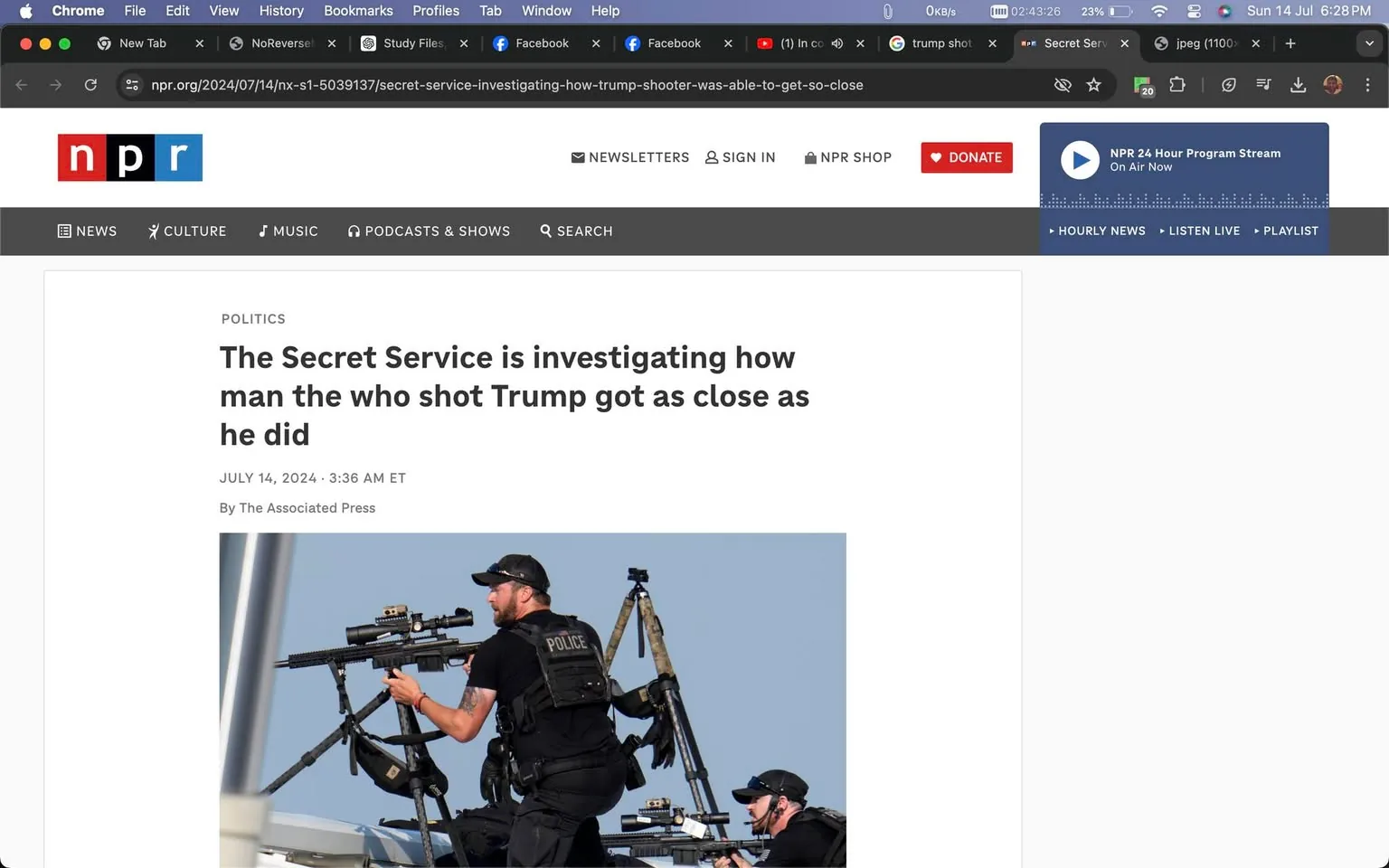 The image is a screenshot of a news article from NPR's website. The headline prominently states, "The Secret Service is investigating how the man who shot Trump got as close as he did," indicating a serious political and security event. The article is attributed to The Associated Press with a timestamp of July 14, 2024, at 3:36 AM ET. The webpage features NPR's distinctive logo in the upper left corner, consisting of the letters "n," "p," and "r" in bold colors against a white background.
Below the headline, an image depicts two security personnel, likely from the Secret Service, based on the hint provided. They are positioned on a rooftop, equipped with tactical gear and holding rifles, showcasing a high-alert security situation. The personnel are dressed in black uniforms with "POLICE" visibly marked on their vests, and one adjusts the scope of his rifle, illustrating their readiness and precision. The sky in the background is clear, contributing to the scene's sense of urgency and focus. The screenshot captures the essence of a high-stakes investigation into a breach of security concerning a high-profile individual.
- Title: "The Secret Service is investigating how the man who shot Trump got as close as he did"
- Site / app: "npr.org"