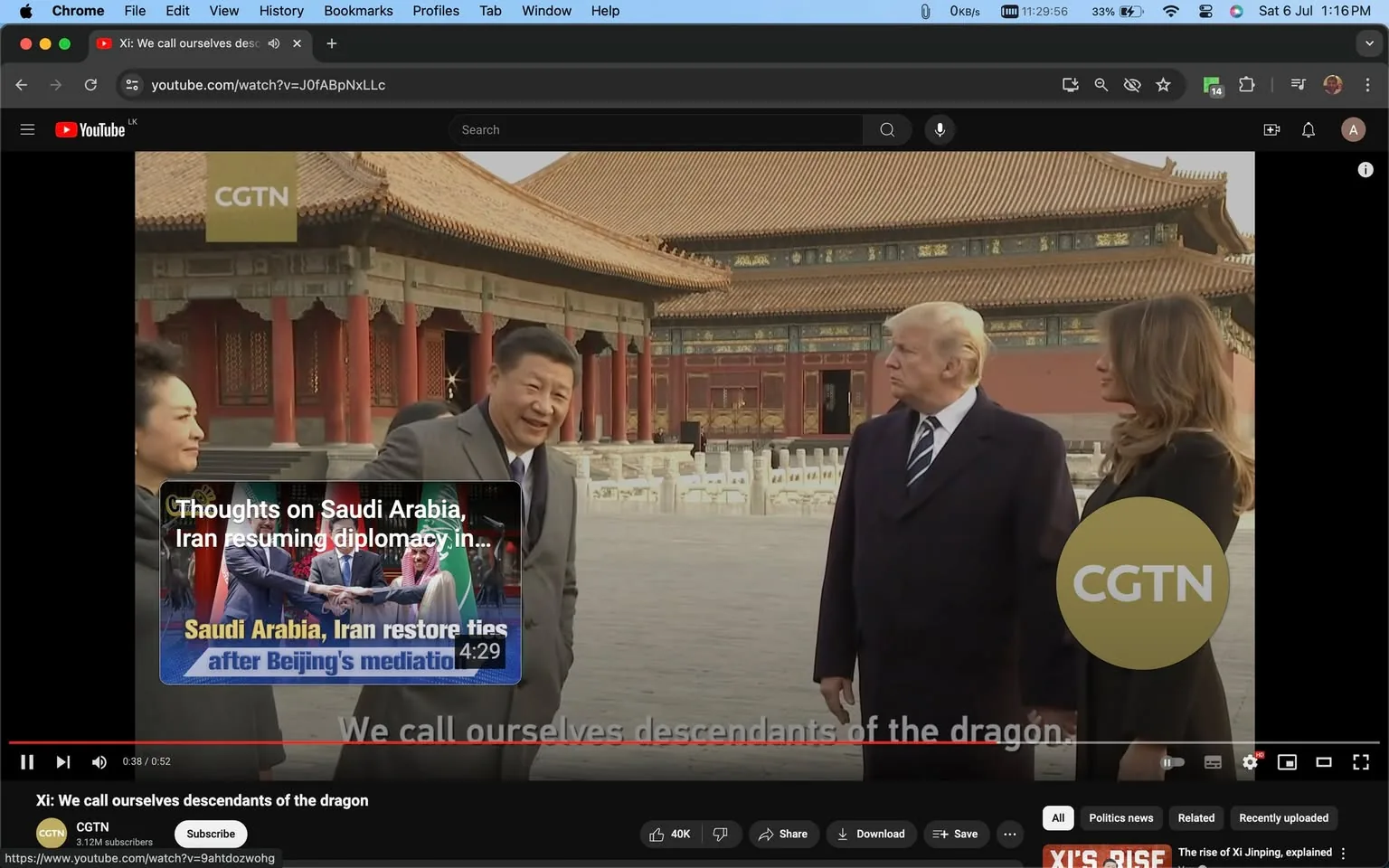 1) Rich description: The image shows a moment captured from a video featuring Xi, Trump, and Melania in an outdoor setting with traditional Chinese architecture in the background. The scene appears to take place in a historical site with red and gold ornate buildings, likely the Forbidden City. Xi is gesturing and speaking, visible in a gray suit, conveying a sense of engagement and warmth. Trump, dressed in a dark overcoat, is standing with a serious expression, while Melania, also in dark attire, looks attentive. The CGTN logo is prominently displayed in the lower right corner, indicating the video’s source. On the screen, captions read, "We call ourselves descendants of the dragon," reflecting the video's theme. An overlay suggests a discussion about Saudi Arabia and Iran resuming diplomacy. The lighting is natural, typical of a daylight setting, enhancing the formal yet cordial mood of the meeting.
2) On-screen text block:
- Title: "Xi: We call ourselves descendants of the dragon"
- Channel / profile: "CGTN"
- Site / app: "YouTube"
- Captions / subtitles: "We call ourselves descendants of the dragon"