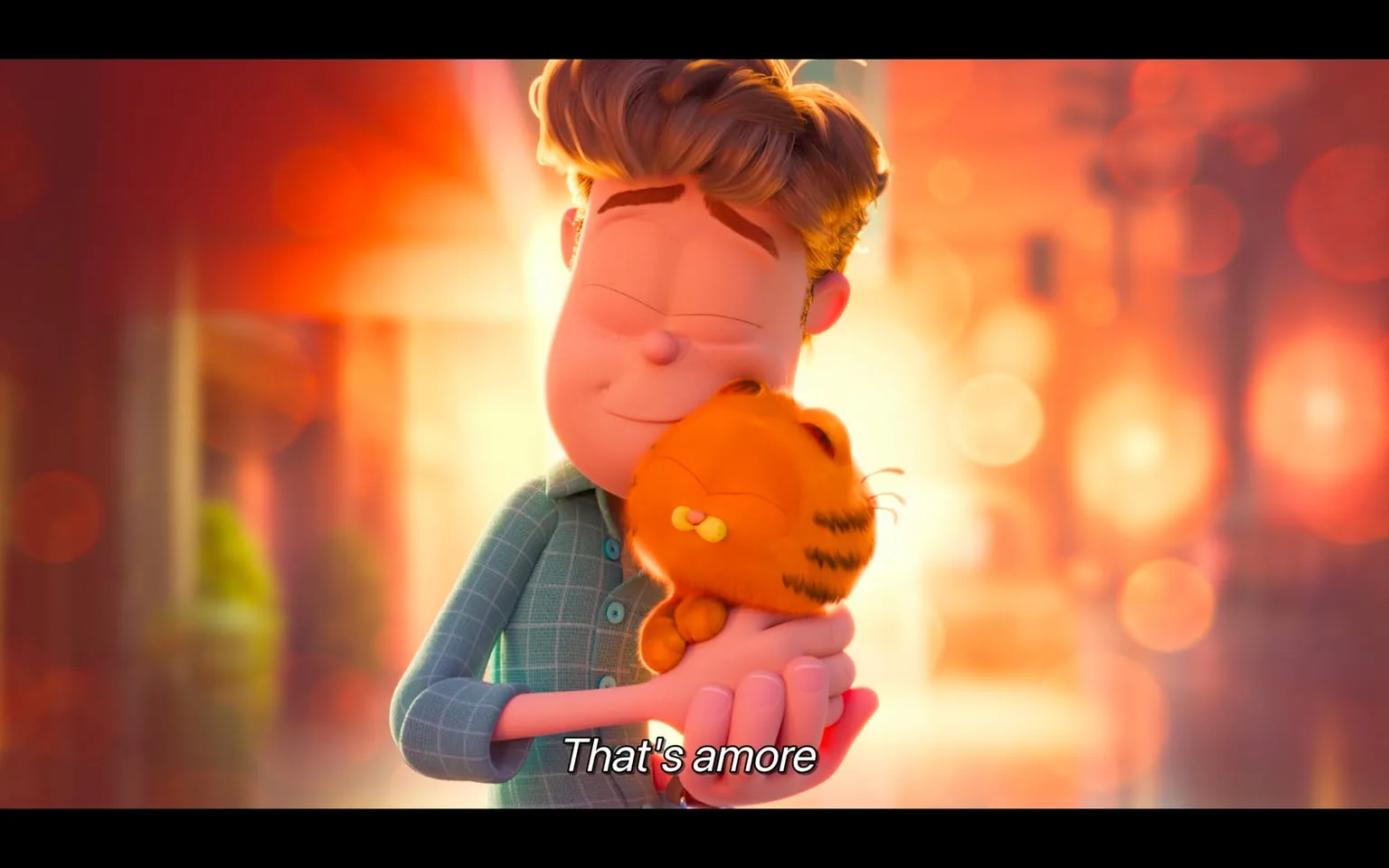 This image is a vibrant animated scene featuring the beloved character Garfield. Garfield, the iconic orange tabby cat, is being affectionately embraced by a young man, creating a heartwarming moment. The man, with his eyes closed in a display of contentment, has short, tousled brown hair and is wearing a blue checkered shirt. The background is awash with warm, glowing hues, suggesting a beautiful sunset, enhancing the tender mood of the scene. The soft lighting and bokeh effect add a dreamy quality to the image.
Garfield looks blissful, with his eyes closed and a slight smile, as he enjoys the embrace. This scene captures a sense of affection and companionship between the two characters. The caption "That's amore" at the bottom of the image reinforces the theme of love and warmth. The art style is colorful and smooth, typical of contemporary animation. The setting appears to be an outdoor location, perhaps a street or a park, bathed in the warm colors of the setting sun.