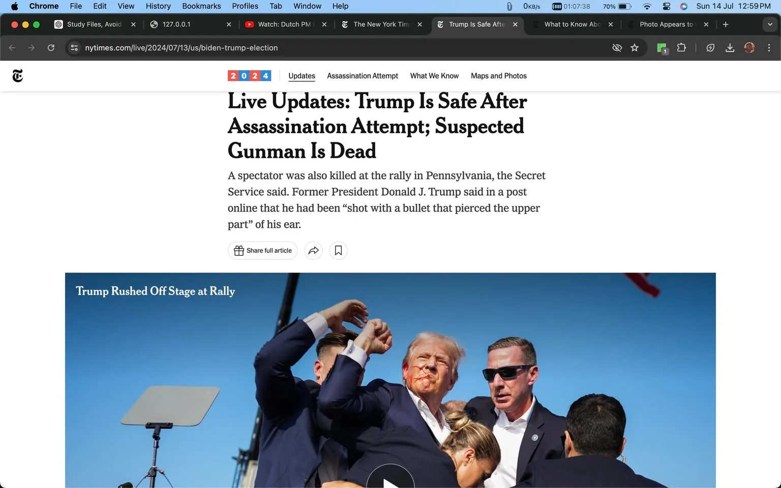 ```
1) Rich description (8–12 sentences): The image shows a dramatic scene at a rally where Donald Trump is being hurriedly escorted off stage by security personnel. Donald Trump appears in the center of the image with a concerned expression, showing a visible injury on his face. He is flanked by men in dark suits, one of whom is identified as Sean Curran, providing security. The scene is set against a clear blue sky, indicating an outdoor rally. The lighting is bright and natural, emphasizing the urgency and seriousness of the situation. Several people surround Trump, illustrating a tense and protective atmosphere. In the background, a teleprompter is visible, suggesting an organized event disrupted by the incident. The headline and accompanying article describe an assassination attempt with the suspected gunman reportedly dead. The image captures a moment of high alert and rapid response as Trump's security team acts swiftly to ensure his safety.
2) On-screen text block:
- Title: "Live Updates: Trump Is Safe After Assassination Attempt; Suspected Gunman Is Dead"
- Site / app: "The New York Times"