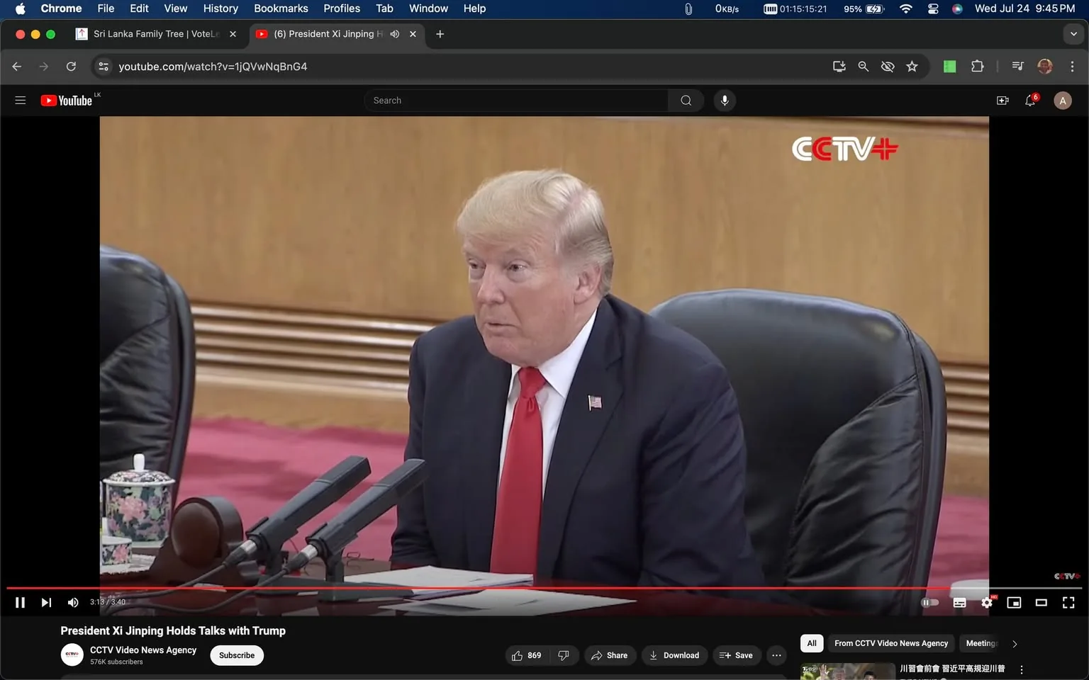 In this screenshot, Donald Trump is seated in a formal setting, likely during a diplomatic meeting or conference. He is wearing a dark suit with a red tie and a white shirt, fitting the formal atmosphere. His expression appears attentive and engaged, suggesting active participation in the discussions. In front of him, multiple microphones are visible, indicating that he might be addressing the meeting or preparing to speak.
The background is simple, with wood paneling, adding to the formal atmosphere of the setting. A floral-patterned teacup can be seen on the table, adding a subtle decorative element. The setting suggests a high-level diplomatic engagement, further emphasized by the video's title indicating a meeting with President Xi Jinping.
The YouTube interface is visible, showing the video hosted on the "CCTV Video News Agency" channel. The video title, "President Xi Jinping Holds Talks with Trump," clearly indicates the context of the meeting. The channel’s logo, CCTV+, is displayed in the upper right corner of the video frame.