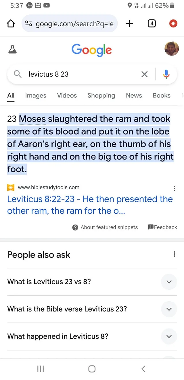 The image is a screenshot of a Google search result for "Leviticus 8 23." The search bar at the top displays this query, indicating the user is looking up a Bible verse. Below the search bar, a highlighted text snippet from BibleStudyTools.com displays the verse: "Moses slaughtered the ram and took some of its blood and put it on the lobe of Aaron's right ear, on the thumb of his right hand and on the big toe of his right foot." This snippet is part of the religious text from the Book of Leviticus in the Bible.
The screenshot includes a section labeled "People also ask," featuring related questions like "What is Leviticus 23 vs 8?" and "What happened in Leviticus 8?" The page is displayed on a mobile device with a visible battery and time indicators at the top of the screen. The user interface shows typical Google search elements, such as tabs for Images, Videos, Shopping, News, and Books. The overall composition conveys a straightforward and informative layout typical of a Google search results page.
