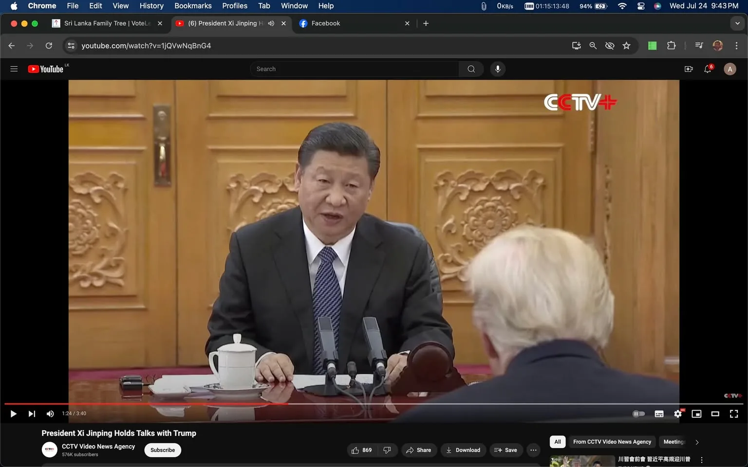 President Xi Jinping is featured in this screenshot from a YouTube video titled "President Xi Jinping Holds Talks with Trump." The video is hosted on the channel "CCTV Video News Agency," and the publisher is "CCTV+." Xi Jinping is seated at a table, engaged in a conversation with another person who is not fully visible in the image. The setting appears to be formal, likely a meeting room with intricately carved wooden doors in the background. Xi Jinping is wearing a dark suit and tie, conveying a professional and diplomatic atmosphere. A white teacup is placed on the table, along with microphones positioned in front of him, indicating a formal meeting or discussion. The lighting is bright, highlighting the room's elegant decor. The presence of the CCTV+ logo on the screen suggests the video is a news broadcast about the diplomatic interaction.