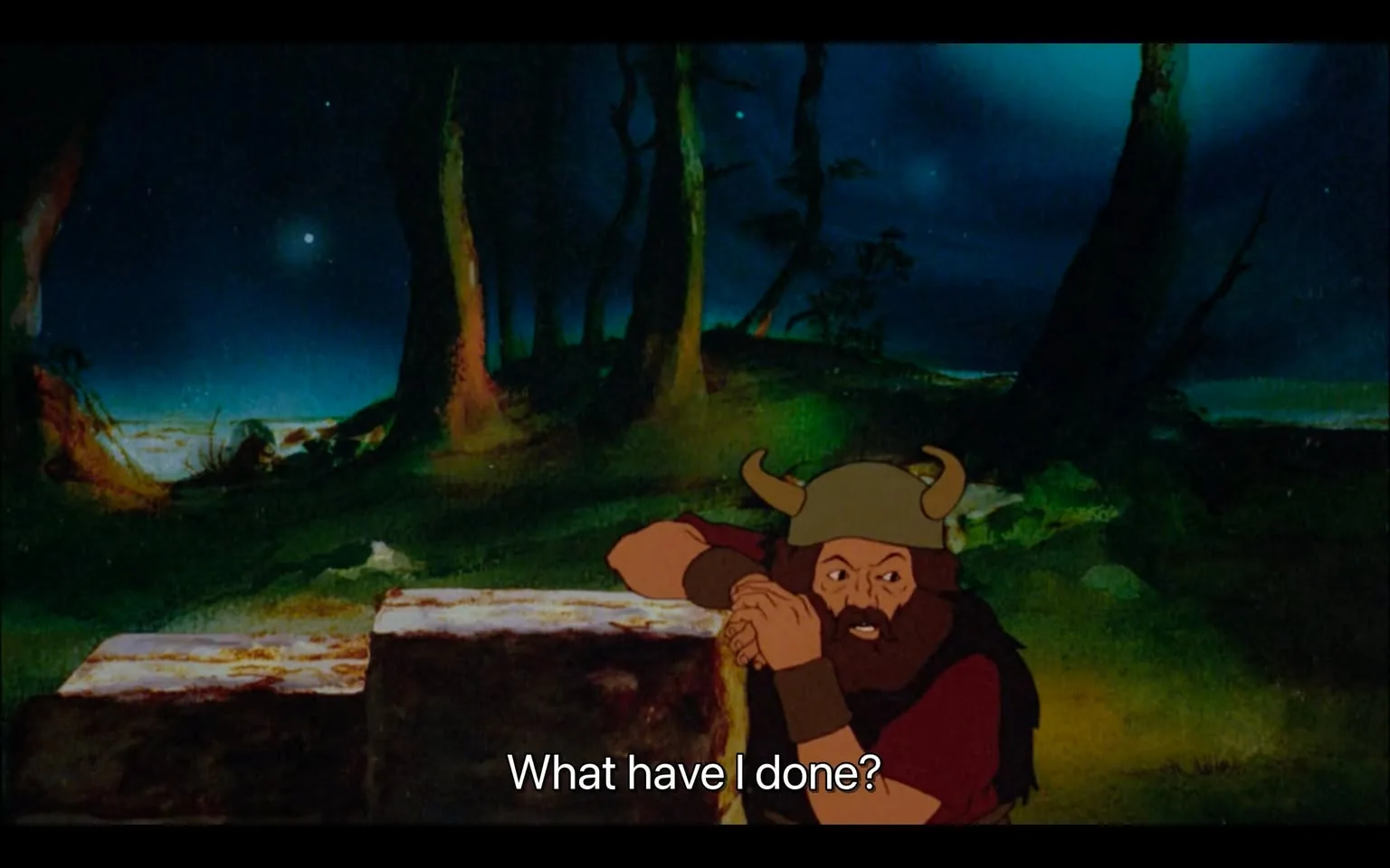 1) This image is a frame from an animated adaptation of "Lord of the Rings" (lotr animation) featuring a character in a dark, mystical forest at night. The scene is rich with deep blues and greens, accentuated by starlit skies and the silhouettes of towering trees. In the foreground, a character wearing a horned helmet and medieval attire appears distressed, with his arms resting on a large stone slab. His expression is one of regret or realization, as indicated by the subtitle, "What have I done?" The character's clothing consists of earthy tones, blending with the natural surroundings. The animation style is traditional, with vividly painted backgrounds and expressive character design. The lighting is dramatic, creating a somber and reflective mood, suggesting a pivotal moment in the story.
2) On-screen text block:
- Captions / subtitles: "What have I done?"
