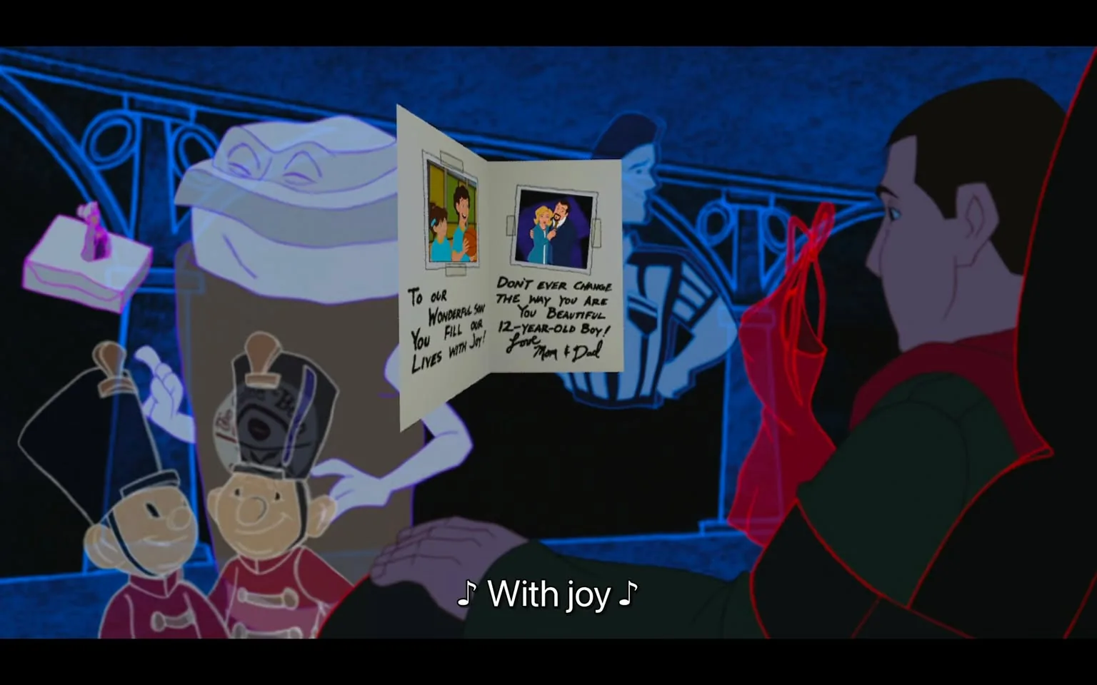 The image is a frame from the animated film "Adam Sandler's 8 Crazy Nights." It features a nostalgic scene where a character is holding a greeting card, reflecting a sentimental moment. The card contains family photos and a heartfelt message from parents to their son, expressing love and encouraging him to remain true to himself as a "beautiful 12-year-old boy." The frame is rich with colors, primarily dark blues and reds, creating a warm yet somber mood typical of reflective holiday films. In the background, outlines of toy soldiers and other festive elements are visible, enhancing the holiday theme. The character holding the card appears contemplative, with a gentle grip on the card, indicating the emotional weight of the message. The artistic style is characteristic of traditional animation, and the lighting emphasizes the card's text, which is crucial to the emotional tone of the scene. The caption at the bottom, "♪ With joy ♪," suggests that music is playing, likely complementing the sentimental atmosphere.