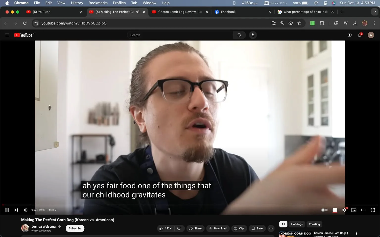 Joshua Weissman is featured in this YouTube video frame, engaged in explaining a culinary topic. He appears to be in a well-lit kitchen, with white cabinets and shelves in the background. Joshua is wearing glasses and has his hair tied back, with a slight beard, focusing intently as he speaks. The environment suggests a casual and informative setting, reflecting his typical style of cooking videos. The video is titled "Making The Perfect Corn Dog (Korean vs. American)," indicating a focus on comparing different styles of corn dogs. The caption visible on screen reads, "ah yes fair food one of the things that our childhood gravitates." This suggests he is discussing the nostalgic elements of fair food. The overall scene conveys a relaxed yet educational vibe, typical of Joshua Weissman's content.
- Title: "Making The Perfect Corn Dog (Korean vs. American)"
- Channel / profile: "Joshua Weissman"
- Site / app: "YouTube"
- Captions / subtitles: "ah yes fair food one of the things that our childhood gravitates"
