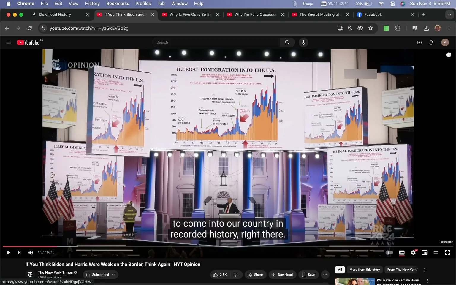 The image is a screenshot from a YouTube video titled "If You Think Biden and Harris Were Weak on the Border, Think Again | NYT Opinion," published by The New York Times. The scene features a presentation with large graphs displayed on several screens. The graphs show data on "ILLEGAL IMMIGRATION INTO THE U.S." with annotations referencing political actions such as "TRUMP tariff threat" and "New DHS" policies. The setting has a formal and staged appearance, with elements resembling a political event, including a podium and American flags.
The large central screen dominates the composition, showcasing a colorful graph with blue and orange bars, accompanied by several smaller screens displaying similar content. The lighting is bright, highlighting the stage and the text. Subtitles at the bottom of the screen read: "to come into our country in recorded history, right there." The screenshot captures a moment from the video where the focus is on presenting immigration data and political analysis, invoking the context of Trump and U.S. border policies.