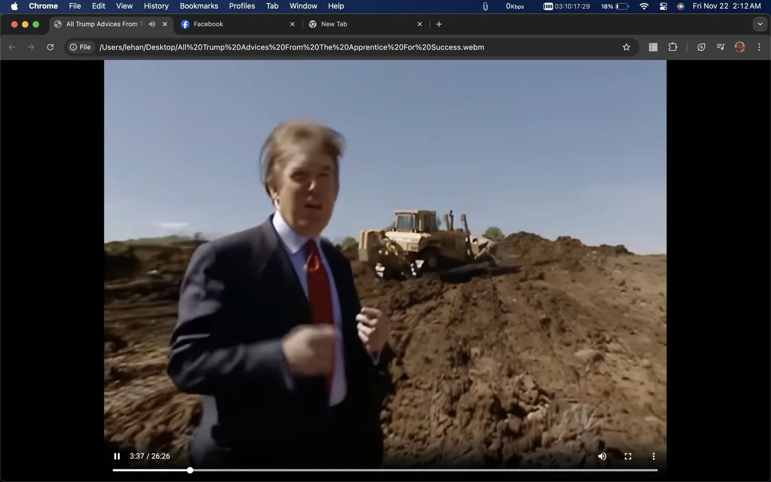 Donald Trump is captured in this video frame standing at a construction site, providing advice. The setting is outdoors on a clear day, with piles of dirt and a bulldozer in the background, indicative of an active construction area. Trump, dressed in a formal dark suit with a white shirt and red tie, is positioned in the foreground. His posture suggests he is speaking or making a point, with one hand gesturing slightly. The scene appears to be part of a segment from "All Trump Advices From The Apprentice For Success," as indicated by the title text. The setting, combined with Trump's attire, suggests a focus on business or leadership advice within a practical, real-world environment. The video is hosted on Facebook, as noted in the browser interface, which includes tabs and navigation options typical of a desktop view. The lighting is bright and natural, enhancing the clarity of the scene and highlighting the earthy tones of the construction site.