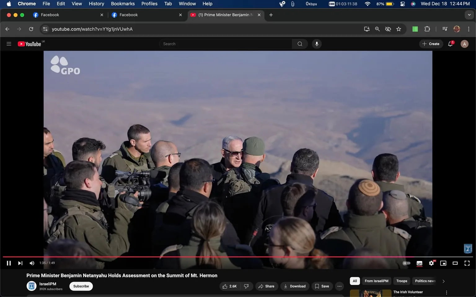 The image is a screenshot from a YouTube video titled "Prime Minister Benjamin Netanyahu Holds Assessment on the Summit of Mt. Hermon" on the "IsraelPM" channel. It shows a group of people, including military personnel, gathered outdoors. They are dressed in military uniforms, suggesting a formal visit or inspection. The background reveals a vast and arid mountainous landscape, consistent with the summit of Mt. Hermon. The lighting is bright, indicating daytime, and the mood appears focused and serious. One individual, possibly Benjamin Netanyahu, is wearing sunglasses and is engaged in conversation with others. The "GPO" logo is visible on the top left, typically associated with official government publications. This setting suggests a strategic or political event, with an emphasis on military and national security discussions.

- Title: "Prime Minister Benjamin Netanyahu Holds Assessment on the Summit of Mt. Hermon"
- Channel / profile: "IsraelPM"
- Site / app: "YouTube"