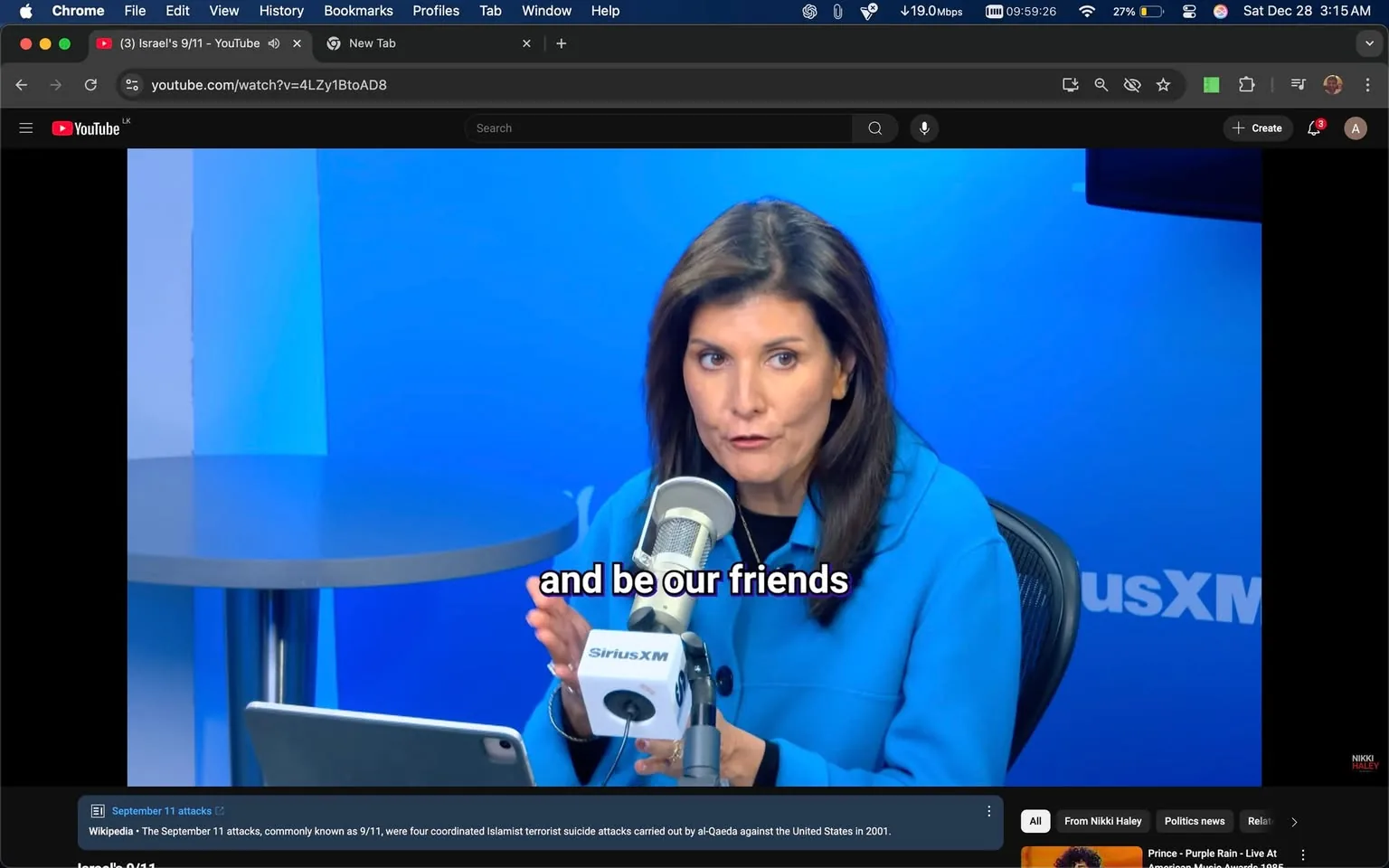 Nikki Haley is featured in this YouTube video still, titled "(3) Israel's 9/11," appearing on her channel. She is sitting at a table in a studio setting with a blue backdrop featuring the SiriusXM logo. Nikki Haley is speaking into a microphone, which has a SiriusXM label on it. She is dressed in a blue outfit, and her expression appears engaged and serious as she gestures with her hands. The studio is well-lit, highlighting her and the equipment, including a tablet on the desk in front of her. The YouTube interface is visible at the top, showing the video URL and the browser tabs. The subtitles on the screen read, "and be our friends," indicating part of the conversation at this moment.