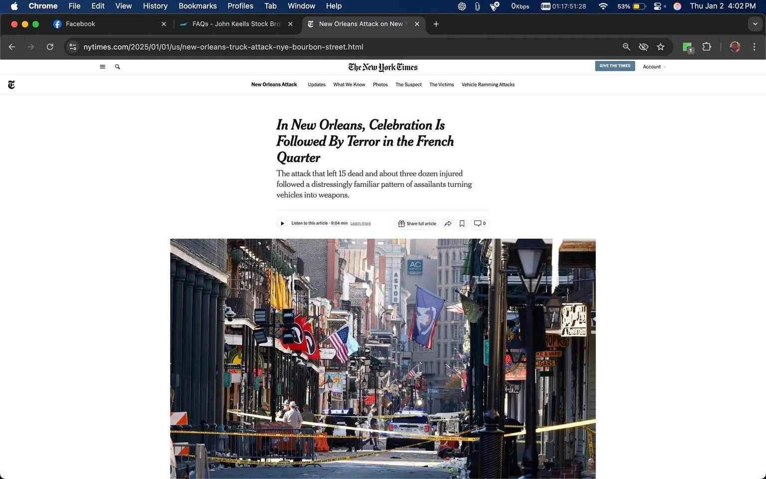 In the image, a street in the French Quarter of New Orleans is shown, marked by police vehicles and yellow caution tape, suggesting a recent incident that has caused disruption. The scene appears to be outdoors, with a clear sky and daylight illuminating the area. Various flags are visible hanging from buildings, and the architecture reflects the historic style typical of the region. The street is mostly empty, with a few individuals in the distance, likely law enforcement or emergency personnel. The presence of police vehicles and the caution tape indicates a serious situation, possibly related to the attack mentioned in the surrounding text.