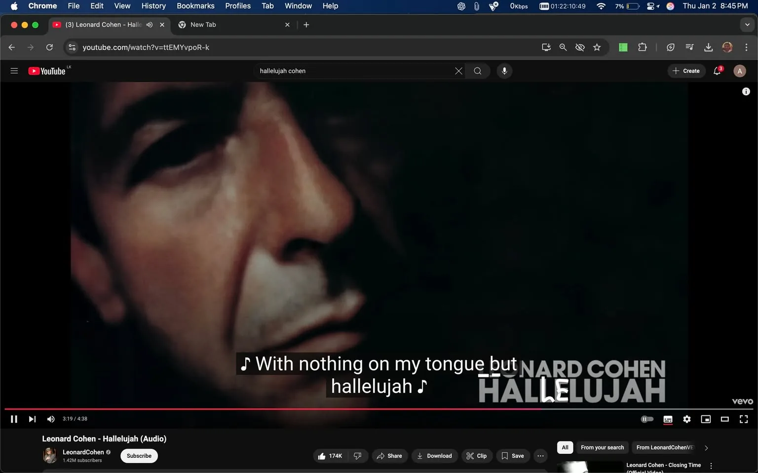 In the image, a close-up of a person's face is prominently displayed, capturing a moment from a music video. The individual appears to be singing, with a focused expression. The background is dark, which contrasts with the lighter tones of the person's skin. Subtitles are visible at the bottom of the screen, displaying the lyrics: "With nothing on my tongue but hallelujah." The video is titled "Leonard Cohen - Hallelujah (Audio)" and is being played on YouTube, as indicated by the interface elements visible around the image. The overall mood is reflective, aligning with the emotional weight of the song's lyrics.