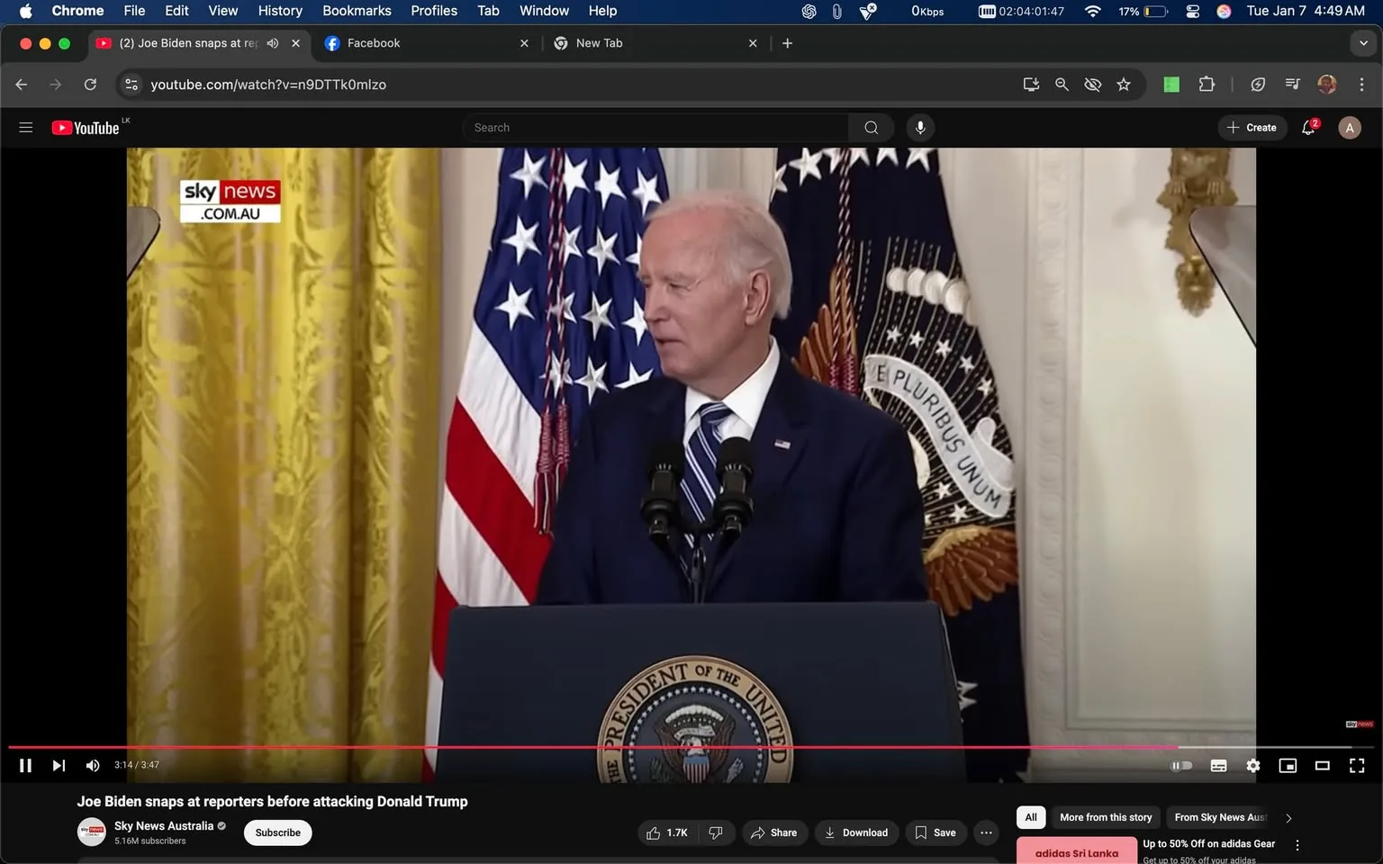 During a press event, a public figure stands at a podium adorned with the presidential seal, flanked by the American flag and another flag. The individual appears to be engaged in a serious discussion, possibly addressing reporters. The setting is indoors, characterized by ornate curtains and a formal atmosphere. The visible text includes a logo for Sky News, indicating the source of the broadcast. The individual is dressed in a dark suit with a striped tie, and their expression suggests a moment of intensity or frustration. The background features decorative elements typical of a formal press room.