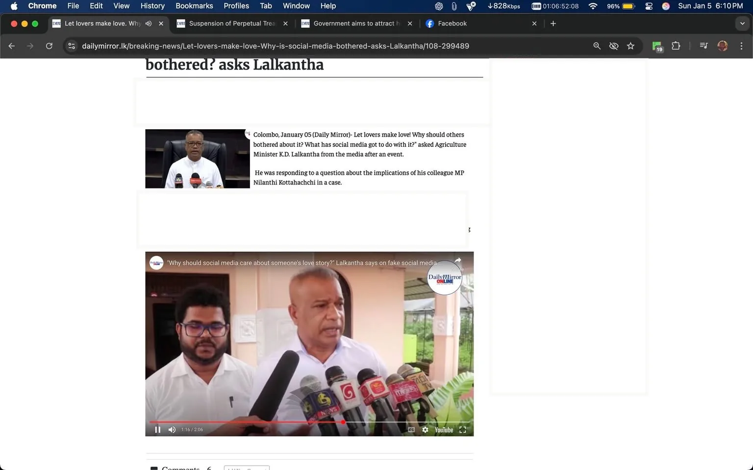 In the article, Agriculture Minister K.D. Lalkantha addresses concerns regarding social media's involvement in personal matters, specifically mentioning a fabricated story about his daughter studying in Canada. He expresses frustration over the media's portrayal of the situation, questioning why others are concerned about his family's affairs. The setting appears to be a press conference or public statement, with Lalkantha speaking into multiple microphones. A second individual, possibly a reporter, stands nearby, wearing glasses and a white shirt. The background suggests an outdoor area, with greenery visible, indicating a casual yet formal atmosphere. The article is dated January 5, 2025, and includes a video segment related to the topic.