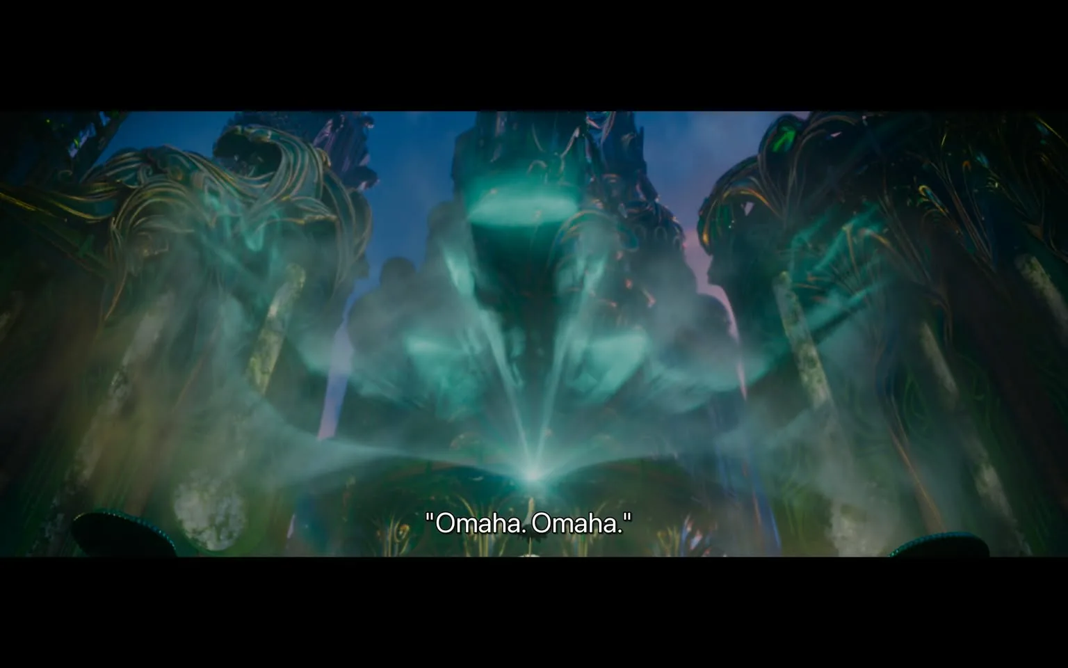 In the image, a mystical and ethereal scene is depicted, characterized by swirling mist and glowing light emanating from a central point. The background features ornate structures that appear to be made of stone or metal, adorned with intricate designs. The colors are vibrant, with shades of green and blue dominating the scene. Below the glowing light, the text "Omaha. Omaha." is visible, suggesting a significant or magical moment. The overall atmosphere conveys a sense of wonder and mystery, with no identifiable people or brands present.