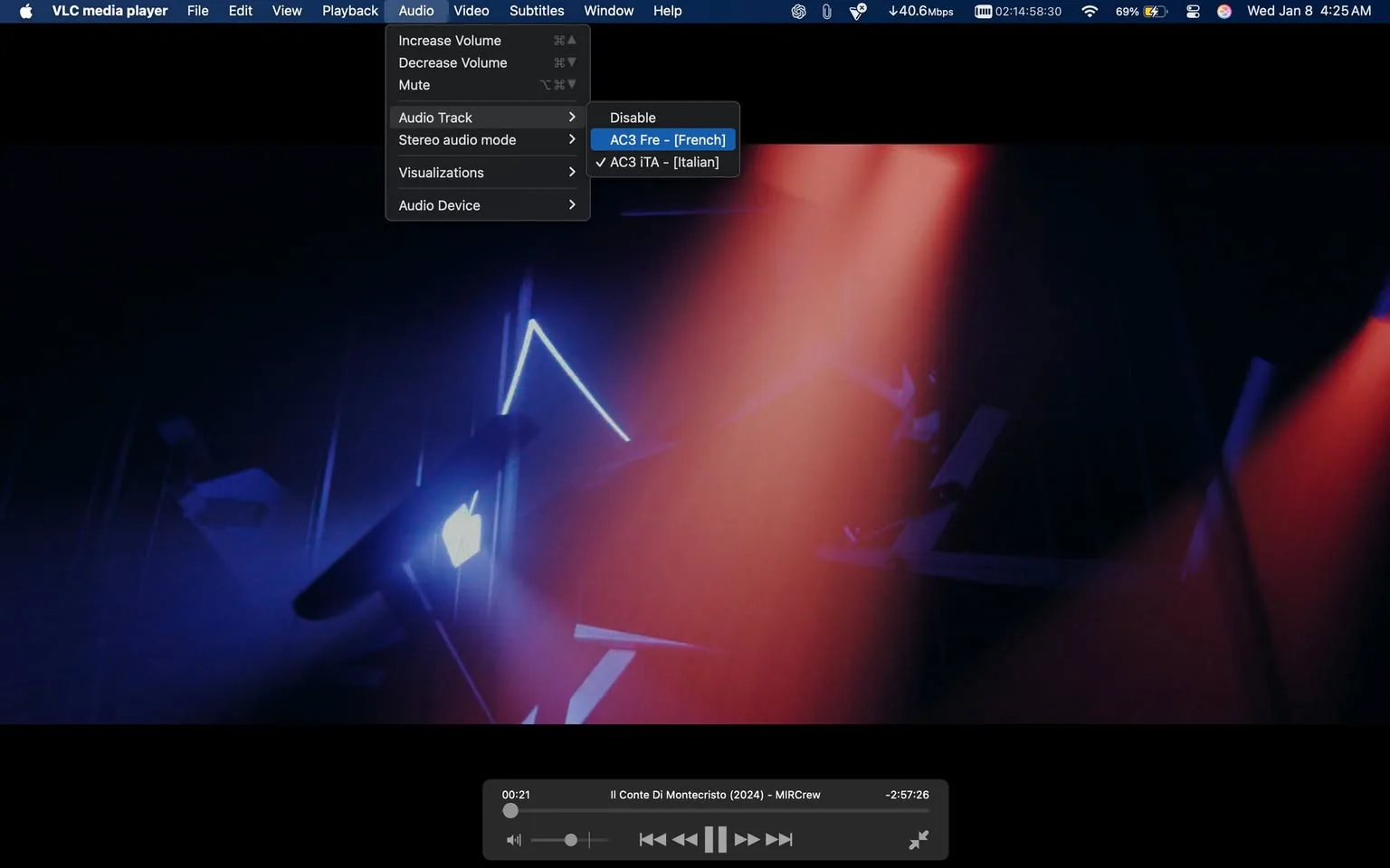The image features the VLC media player interface, prominently displaying a dark background with colorful lighting effects, including blue and red hues. The top menu shows options for audio settings, including volume control and audio track selection, with the current track labeled as "AC3 Fre - [French]" and "AC3 iTA - [Italian]" available. The playback controls at the bottom indicate the video is currently at 21 seconds into "Il Conte Di Montecristo (2024) - MIRCrew," with a total duration of 2 hours and 57 minutes. The interface suggests a cinematic experience, likely indoors, with no visible people or sensitive content present.