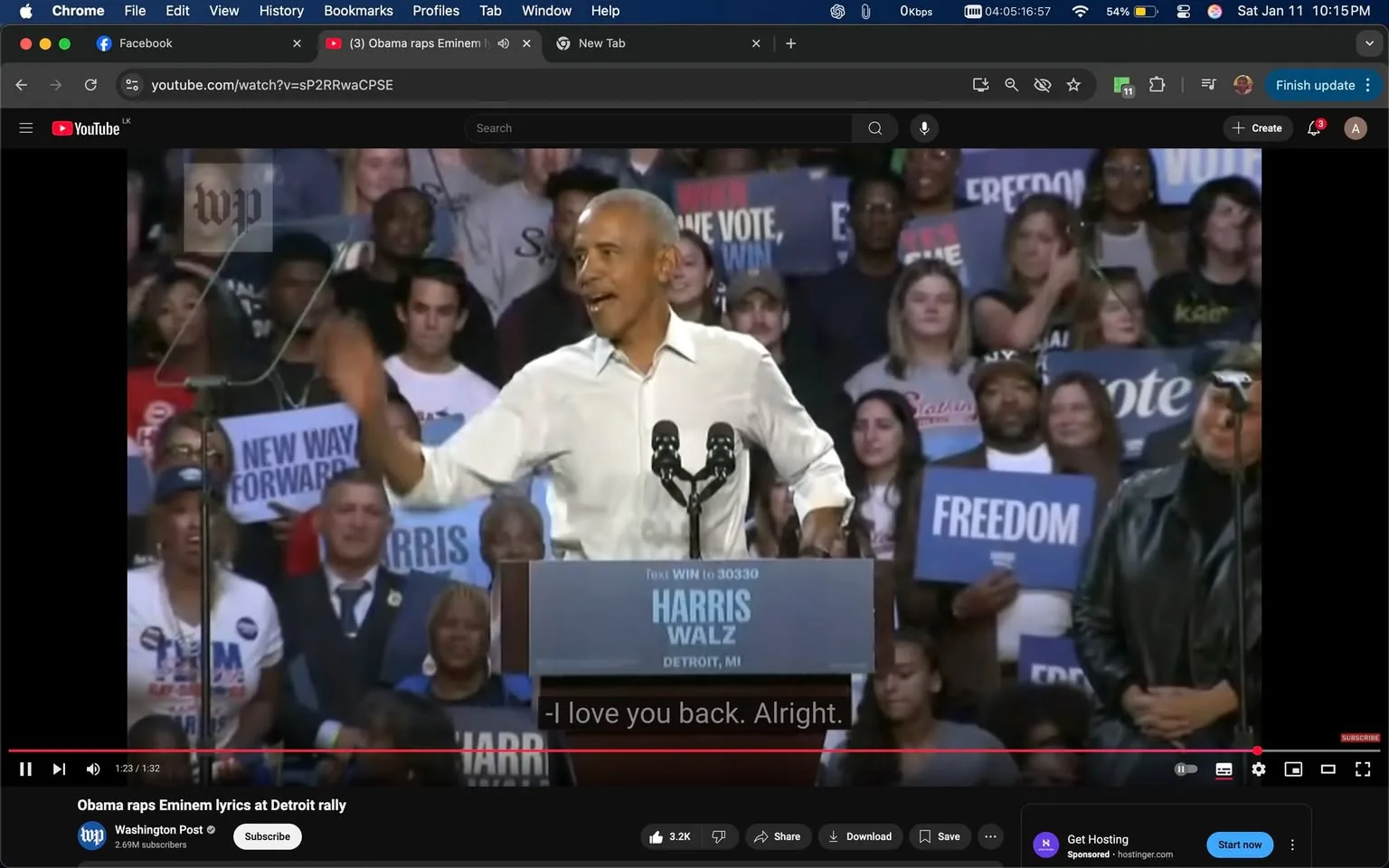 A public figure is speaking at a rally in Detroit, engaging with the audience, who are responding positively. The speaker, dressed in a white shirt, gestures animatedly while addressing the crowd. Behind him, several people hold signs that read "FREEDOM" and "NEW WAY FORWARD," indicating a political theme. The setting appears to be indoors, likely in a large venue, with a diverse audience visible, including individuals of various ages and backgrounds. The atmosphere is energetic, with attendees showing enthusiasm for the speaker's message. The podium displays the name "HARRIS WALZ" and the location, "DETROIT, MI," suggesting a campaign event.