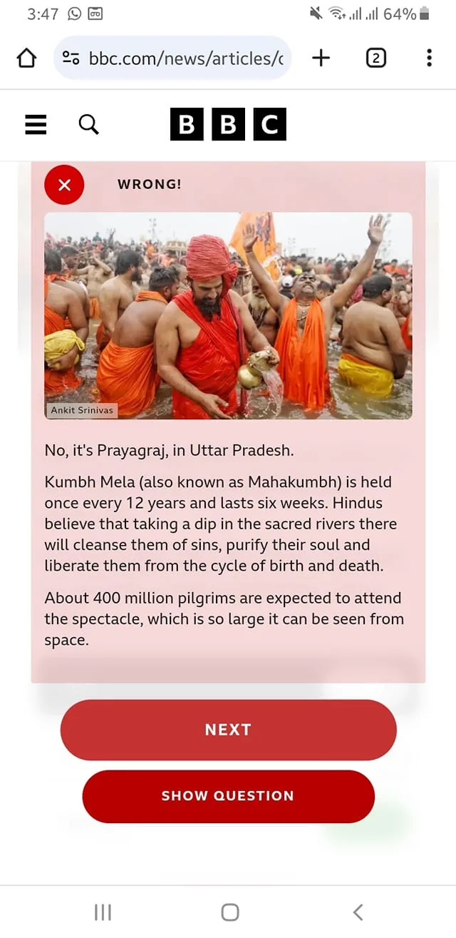 In the image, a large group of individuals is gathered in a river, participating in a religious event, likely the Kumbh Mela, as indicated by the text. The participants are predominantly wearing traditional attire, including orange and saffron robes, which are common among Hindu ascetics. Some individuals are partially clothed, while others are fully dressed. The atmosphere appears vibrant and communal, with many people engaged in activities such as bathing in the river. The background features a crowd and structures that suggest a large-scale event. The text overlay states that this event occurs every 12 years and is significant for cleansing sins and spiritual purification.