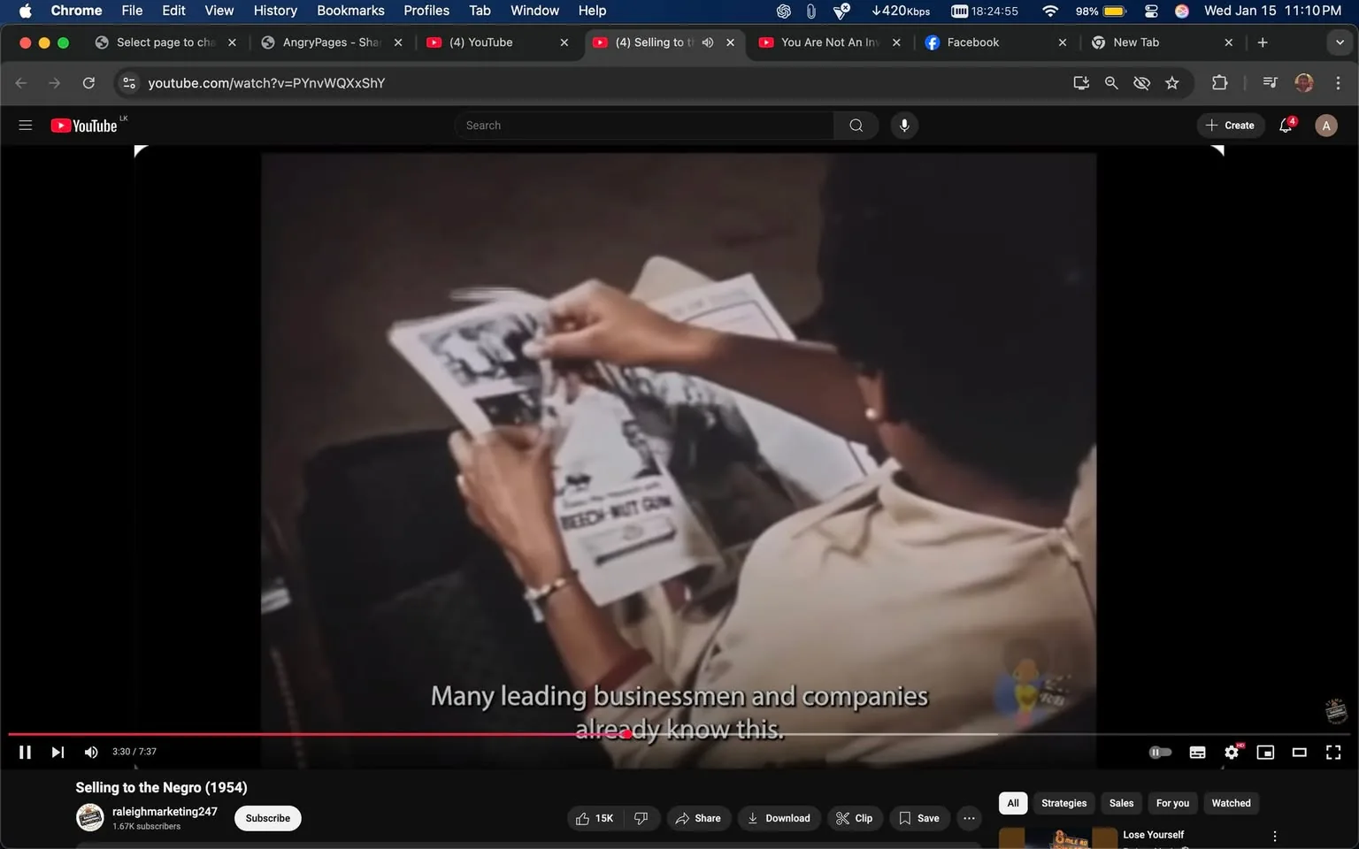 In the image, an unidentified adult is seated and holding a newspaper, examining its contents. The person has short, dark hair and is wearing a light-colored shirt. The newspaper features various images and text, with one section clearly stating "SPEECH NOT GUN." Below this, there is a caption that reads, "Many leading businessmen and companies already know this." The setting appears to be indoors, with a neutral background that does not distract from the main subject. The overall atmosphere suggests a moment of contemplation or analysis regarding the newspaper's content.