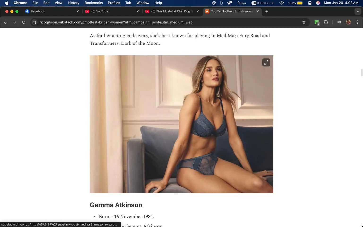 The image features a woman seated on a couch, wearing a blue lingerie set that includes a bra and matching panties. She has long, wavy hair and is posed with a thoughtful expression, looking slightly to her left. The setting appears to be indoors, with soft lighting that creates a warm ambiance. The background includes light-colored walls and a curtain, suggesting a cozy, intimate environment. 

There is no visible branding or logos in the image. The text accompanying the image mentions the name "Gemma Atkinson," along with her birth date of November 16, 1984, and references her acting roles in films such as "Mad Max: Fury Road" and "Transformers: Dark of the Moon." The overall tone of the image and text leans towards a fashion or modeling context, emphasizing beauty and allure.