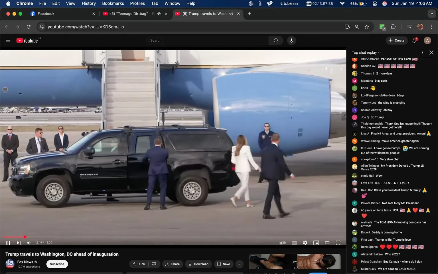 In the image, a black Chevrolet Suburban is parked near a large aircraft, likely Air Force One, which is identifiable by its distinctive blue and white color scheme. The scene appears to be outdoors, possibly at an airport, during daylight. A group of security personnel, dressed in dark suits, stands nearby, maintaining a watchful presence. 

A woman dressed in a white suit is seen walking towards the vehicle, while a man in a suit appears to be assisting her. The woman has long hair and is wearing high heels, suggesting a formal occasion. The atmosphere seems to be one of heightened security and importance, likely related to a significant political event, such as an inauguration. 

The video title indicates this is a moment related to Donald Trump traveling to Washington, D.C. ahead of his inauguration, which adds context to the presence of the security detail and the formal attire. The visible text on the video player indicates it is from Fox News, and there are various comments on the side, expressing opinions about the event and the individuals involved.