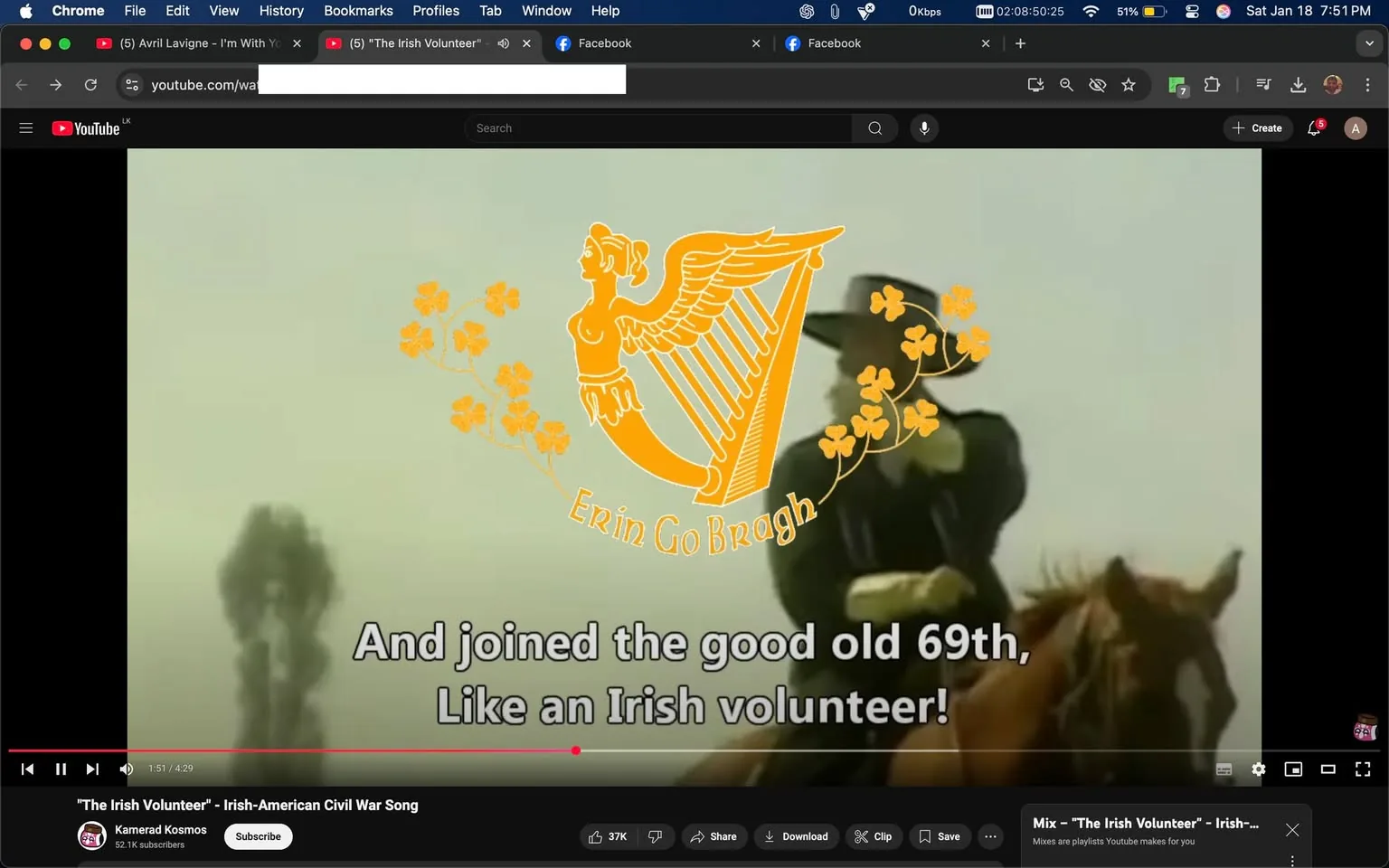 The image features a scene from a video with lyrics displayed prominently on the screen. The text reads, "And joined the good old 69th, Like an Irish volunteer!" The background appears hazy, possibly depicting a historical or military setting, with a figure on horseback partially visible. The image includes a decorative emblem featuring a harp and the phrase "Erin Go Bragh," surrounded by stylized flowers. The overall tone suggests a connection to Irish heritage or military history, likely related to the song being played, which is titled "The Irish Volunteer." The video is hosted on YouTube, and the channel name "Kamrad Kosmos" is visible, indicating it may focus on historical or cultural content.