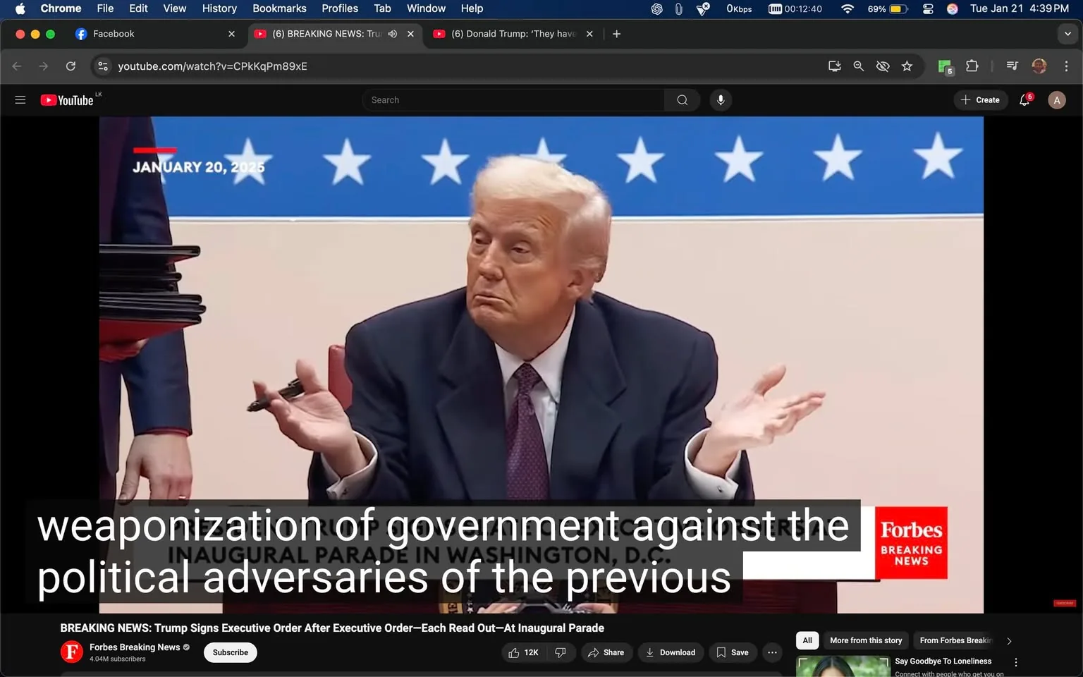In the image, a man with light-colored hair and a suit is seated at a table, appearing to engage in a discussion or presentation. He has a neutral expression, with his hands raised in a shrugging gesture, suggesting a sense of uncertainty or questioning. The background features a blue banner adorned with white stars, indicating a political or formal setting, likely related to a government event. 

Text on the screen reads "January 20, 2025," suggesting a future date significant to the context of the discussion. Below the main subject, there is a caption that mentions the "weaponization of government against the political adversaries of the previous," indicating a political theme. 

To the right, a logo for "Forbes" is visible, indicating the source of the video or news. The overall atmosphere appears serious, reflecting the gravity of the topics being discussed. There are no visible signs of violence or sexual content in the image, and the focus remains on the political discourse.