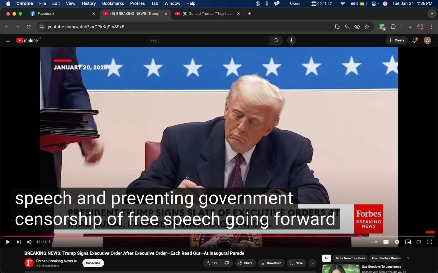 In the image, a public figure is seated at a table, focused on signing documents. He has light-colored hair and is wearing a dark suit with a white shirt and a tie. The setting appears to be indoors, likely in a formal office or event space, indicated by the presence of a backdrop featuring a row of white stars on a blue field. The date "JANUARY 20, 2025" is prominently displayed above him. To his left, a person is holding a stack of black folders, suggesting that they may be related to the documents being signed. The text overlay indicates that he is signing a slate of executive orders, specifically addressing issues related to free speech and government censorship. The logo of Forbes is visible in the bottom right corner, indicating that this is a news segment. The overall atmosphere is serious and formal, typical of a governmental or political event.