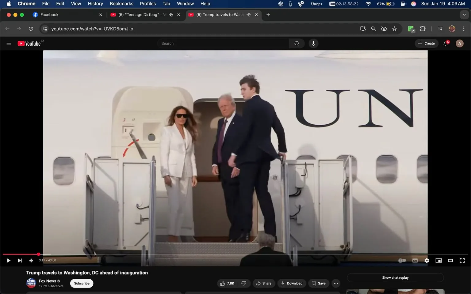 An unidentified adult male and an unidentified adult female are seen descending the stairs of an aircraft, which has the letters "UN" prominently displayed on its side. The female is dressed in a white suit and wearing sunglasses, while the male is in a dark suit with a tie. They appear to be in a public setting, likely at an airport, as they exit the plane. The background shows a clear sky, indicating daytime. The scene captures a moment of arrival, with the individuals appearing composed and focused on their surroundings. There are no visible signs of violence or sexual content in the image.