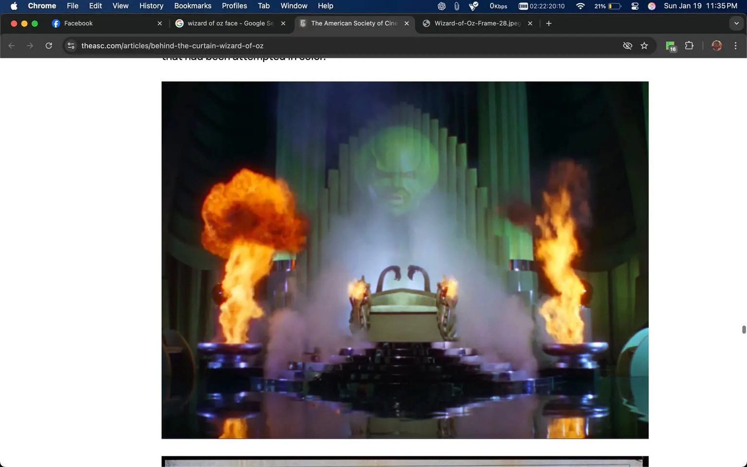 In a dramatic and iconic scene, a large, imposing figure looms in the background, surrounded by vibrant flames and smoke. The setting appears to be a fantastical throne room, characterized by its grand architecture, featuring tall, green columns and a large, stylized face projected onto the backdrop. The throne itself is centrally placed, adorned with intricate designs and flanked by two fiery columns that emit bright orange flames, creating a striking contrast against the darker elements of the scene. The floor is reflective, enhancing the visual impact of the flames and smoke, which adds to the overall atmosphere of mystery and power. The lighting is dramatic, emphasizing the theatrical nature of the environment, reminiscent of classic cinematic storytelling. This scene is likely from a well-known film, known for its fantastical elements and memorable characters.